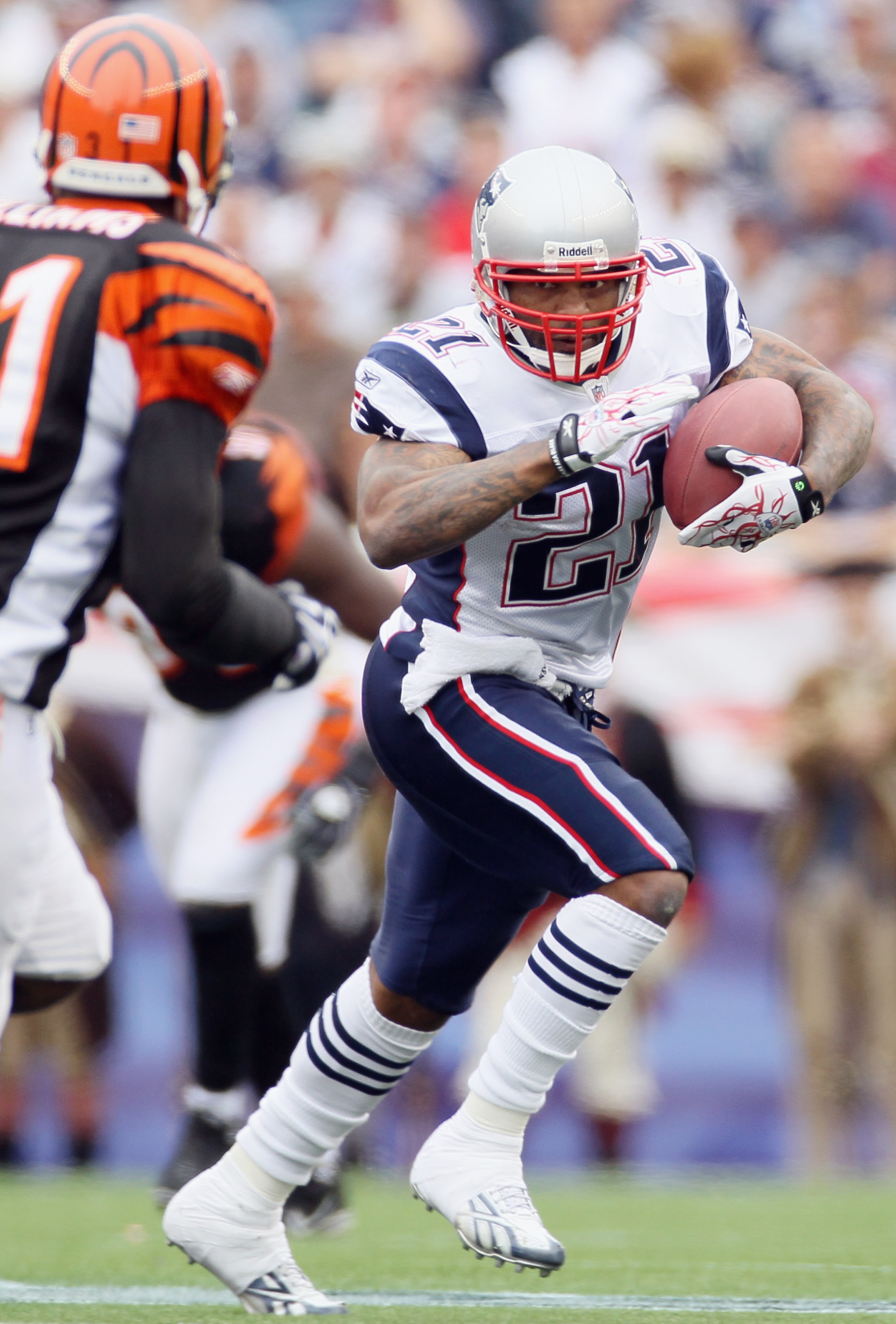 FOXBORO, MA - SEPTEMBER 12: Fred Taylor #21 of the New England Patriots carries the ball as Roy Williams #31 defends during the NFL season opener on September 12, 2010 at Gillette Stadium in Foxboro, Massachusetts. The Patriots defeated the Bengals 38-24 FOXBORO, MA - SEPTEMBER 12: Fred Taylor #21 of the New England Patriots carries the ball as Roy Williams #31 defends during the NFL season opener on September 12, 2010 at Gillette Stadium in Foxboro, Massachusetts. The Patriots defeated the Bengals 38-24