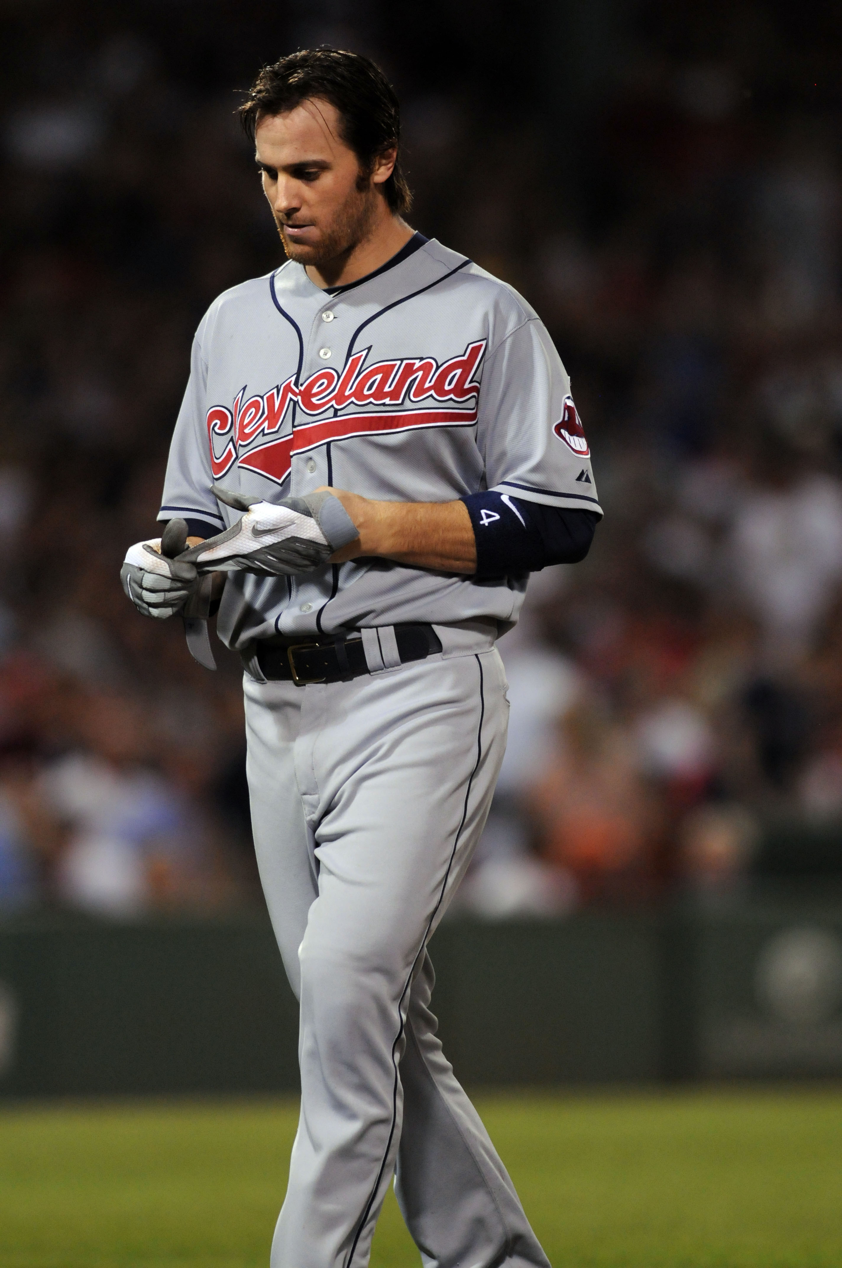 BOSTON, MA - AUGUST 5:  Trevor Crowe #4 of the Cleveland Indians walks off after grounding out against the Boston Red Sox August 5, 2010 at Fenway Park in Boston, Massachusetts. (Photo by Darren McCollester/Getty Images)