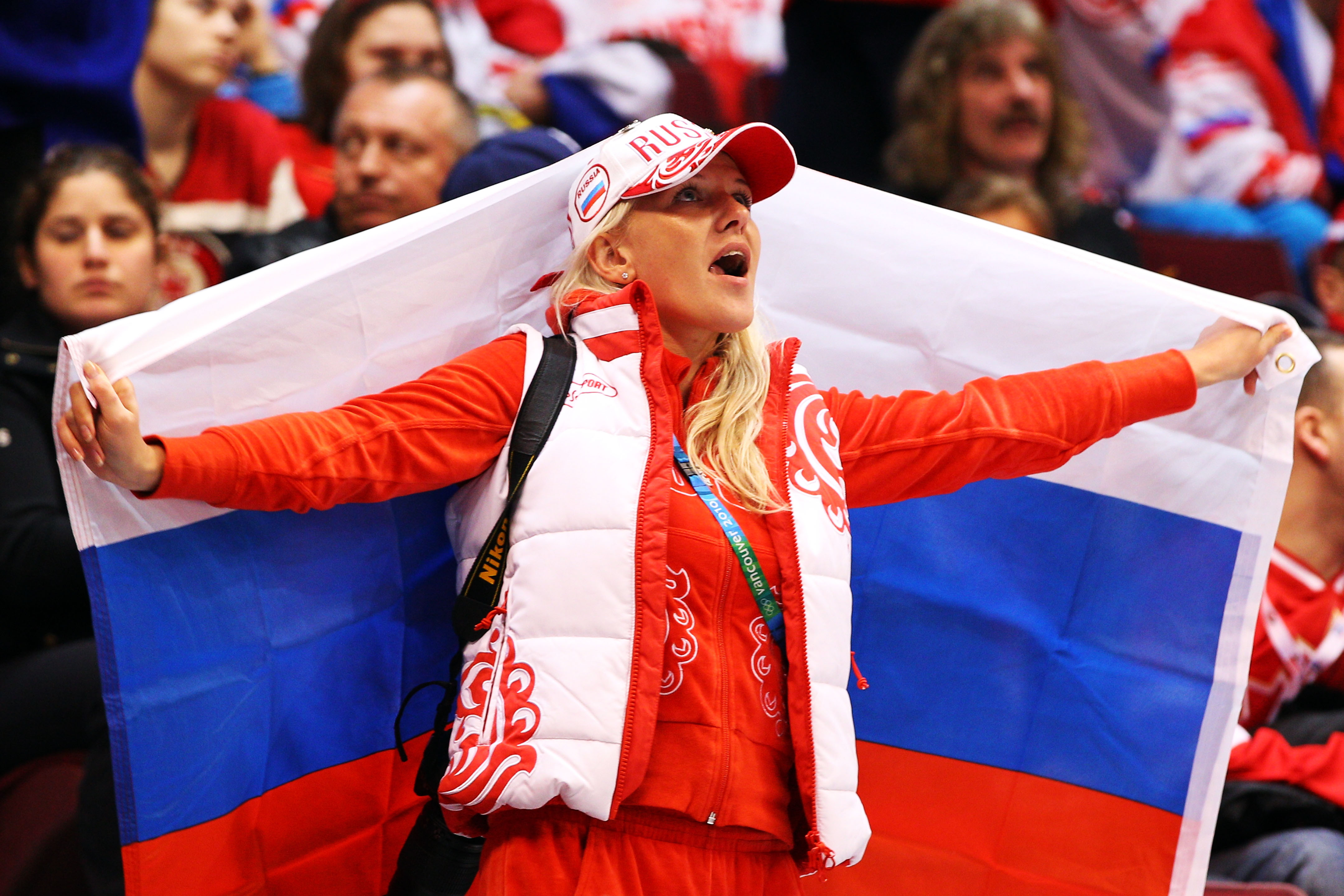VANCOUVER, BC - FEBRUARY 24:  A fan of Russia holds a flag in the stands during the ice hockey men's quarter final game between Russia and Canada on day 13 of the Vancouver 2010 Winter Olympics at Canada Hockey Place on February 24, 2010 in Vancouver, Can