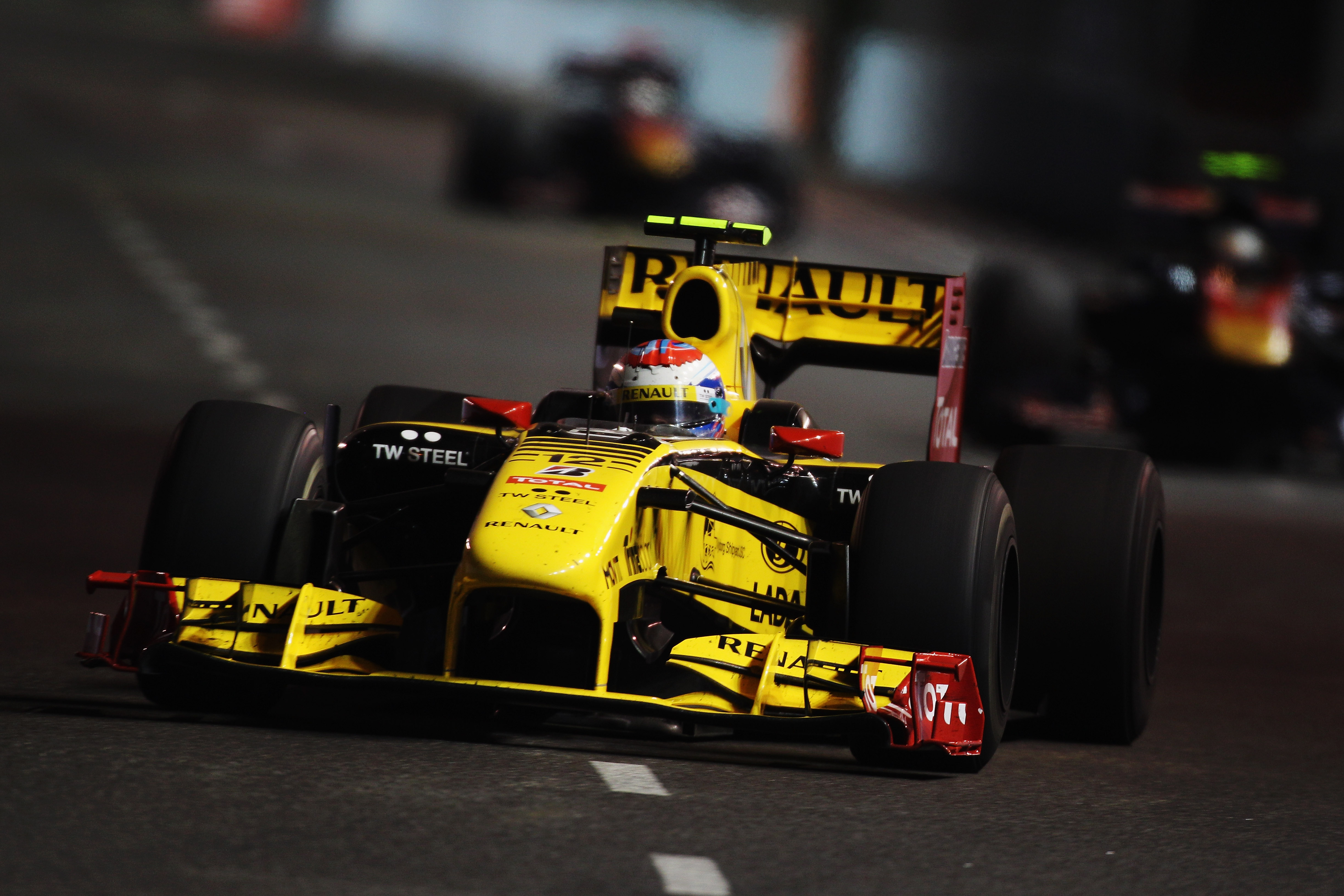 SINGAPORE - SEPTEMBER 26:  Vitaly Petrov of Russia and Renault drives during the Singapore Formula One Grand Prix at the Marina Bay Street Circuit on September 26, 2010 in Singapore.  (Photo by Mark Thompson/Getty Images)