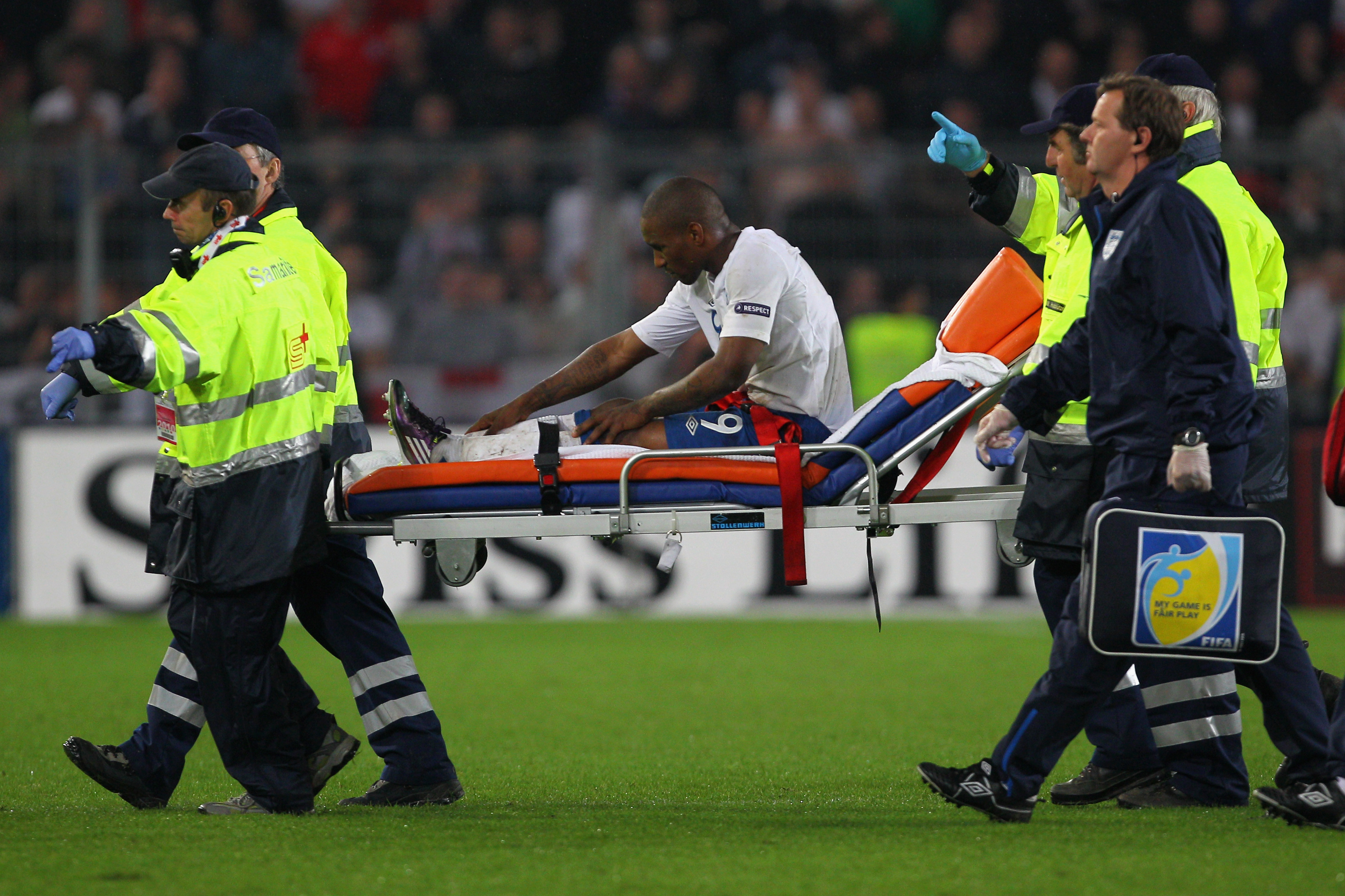 BASEL, SWITZERLAND - SEPTEMBER 07:  Jermain Defoe of England leaves the field on a stretcher after being injured during the UEFA EURO 2012 Group G Qualifier between Switzerland and England at St Jakob Park on September 7, 2010 in Basel, Switzerland.  (Pho