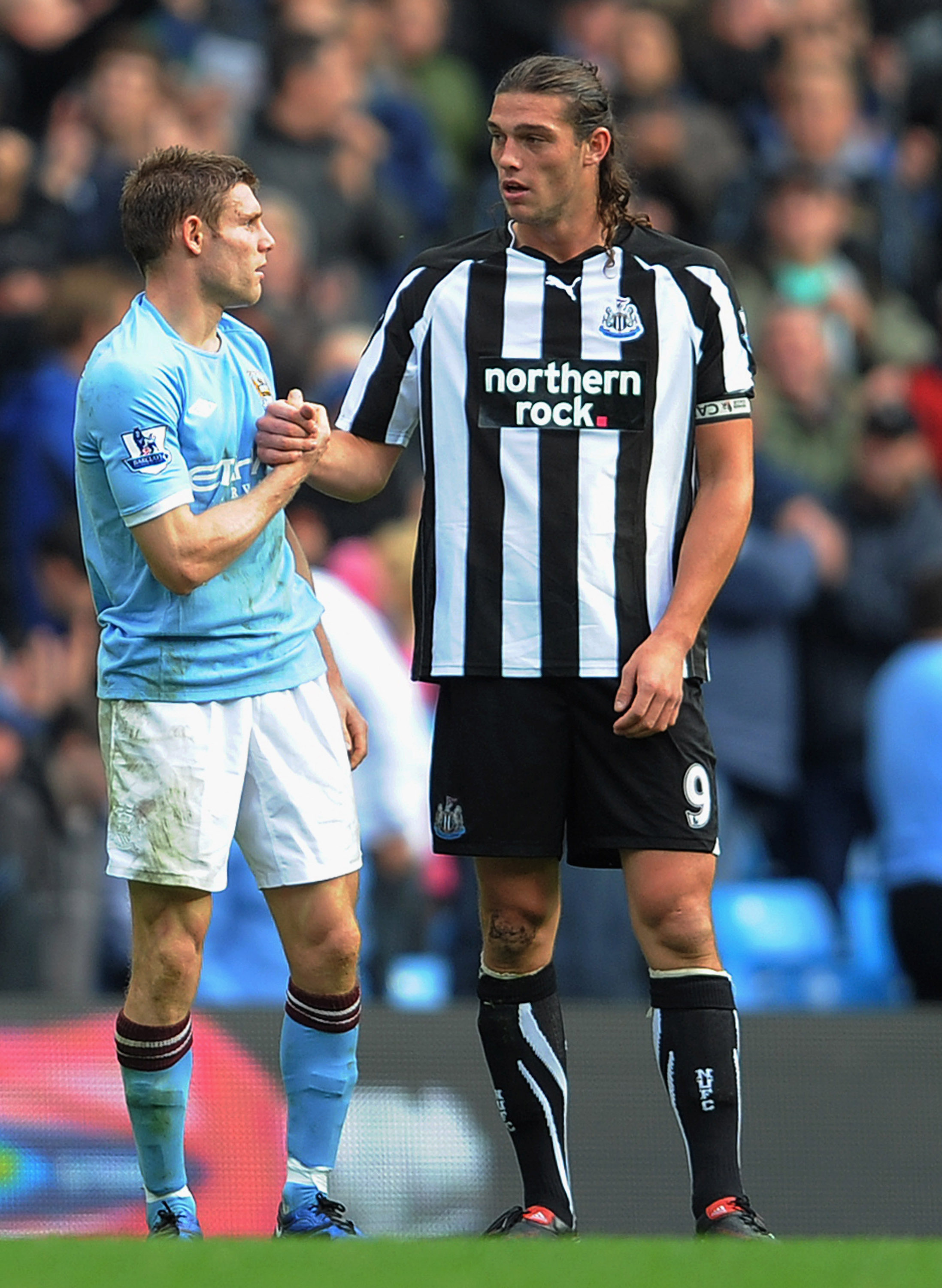 MANCHESTER, ENGLAND - OCTOBER 03: Andy Carroll of Newcastle shakes hands with James Milner of Manchester City after the Barclays Premier League match between Manchester City and Newcastle United at the City of Manchester Stadium on October 3, 2010 in Manc