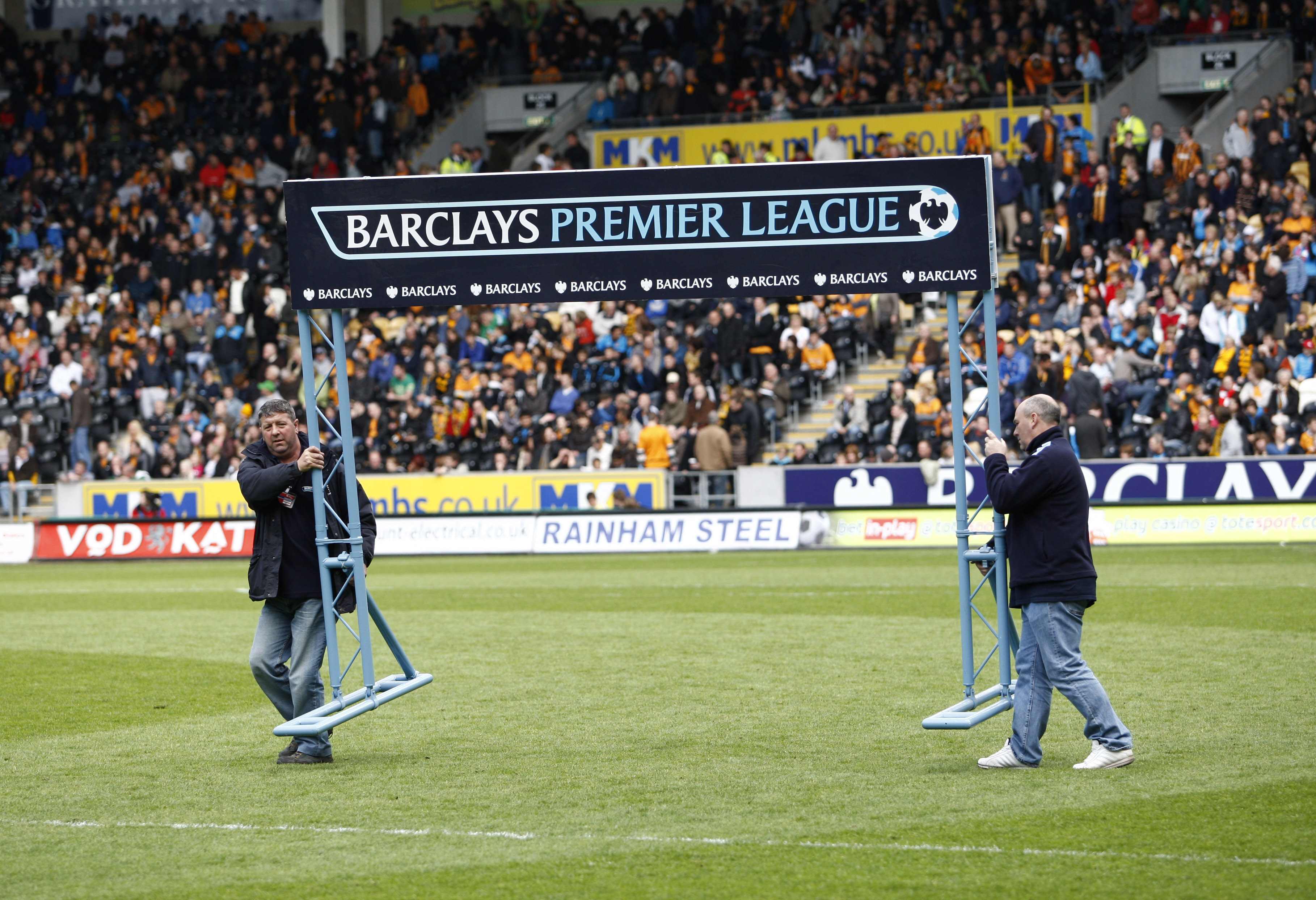 HULL, ENGLAND - MAY 9: The Barclay Premier League sign is removed from the pitch just before the start of the final premier league game at relegated Hull City's KC stadium during the Barclays Premier League match between Hull City and Liverpool at the KC 