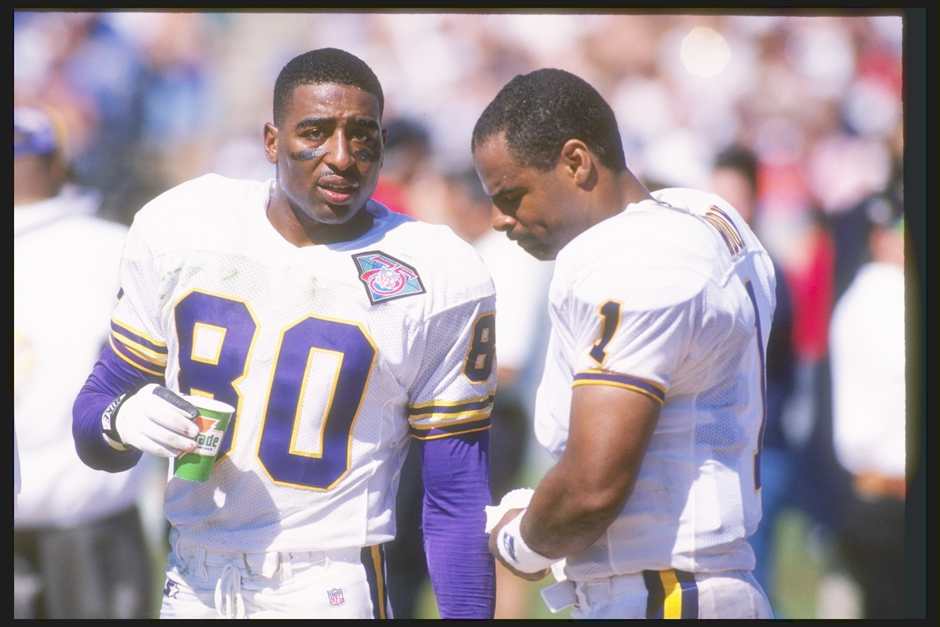 Minnesota Vikings - Cris Carter and Randy Moss on the sidelines during a  game in 1999.