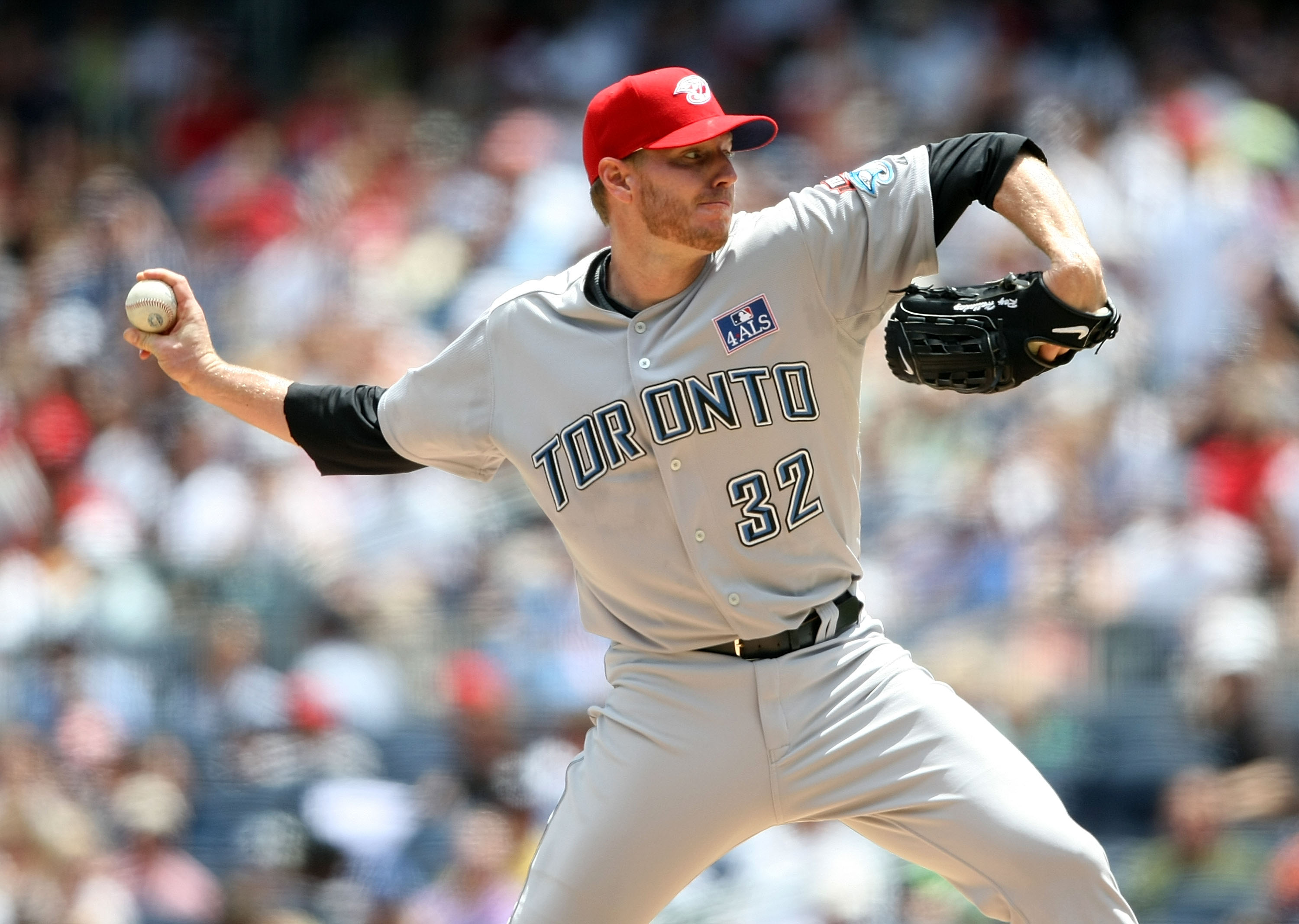NEW YORK - JULY 04:  Roy Halladay #32 of the Toronto Blue Jays pitches against the New York Yankees on July 4, 2009 at Yankee Stadium in the Bronx borough of New York City.  (Photo by Nick Laham/Getty Images)