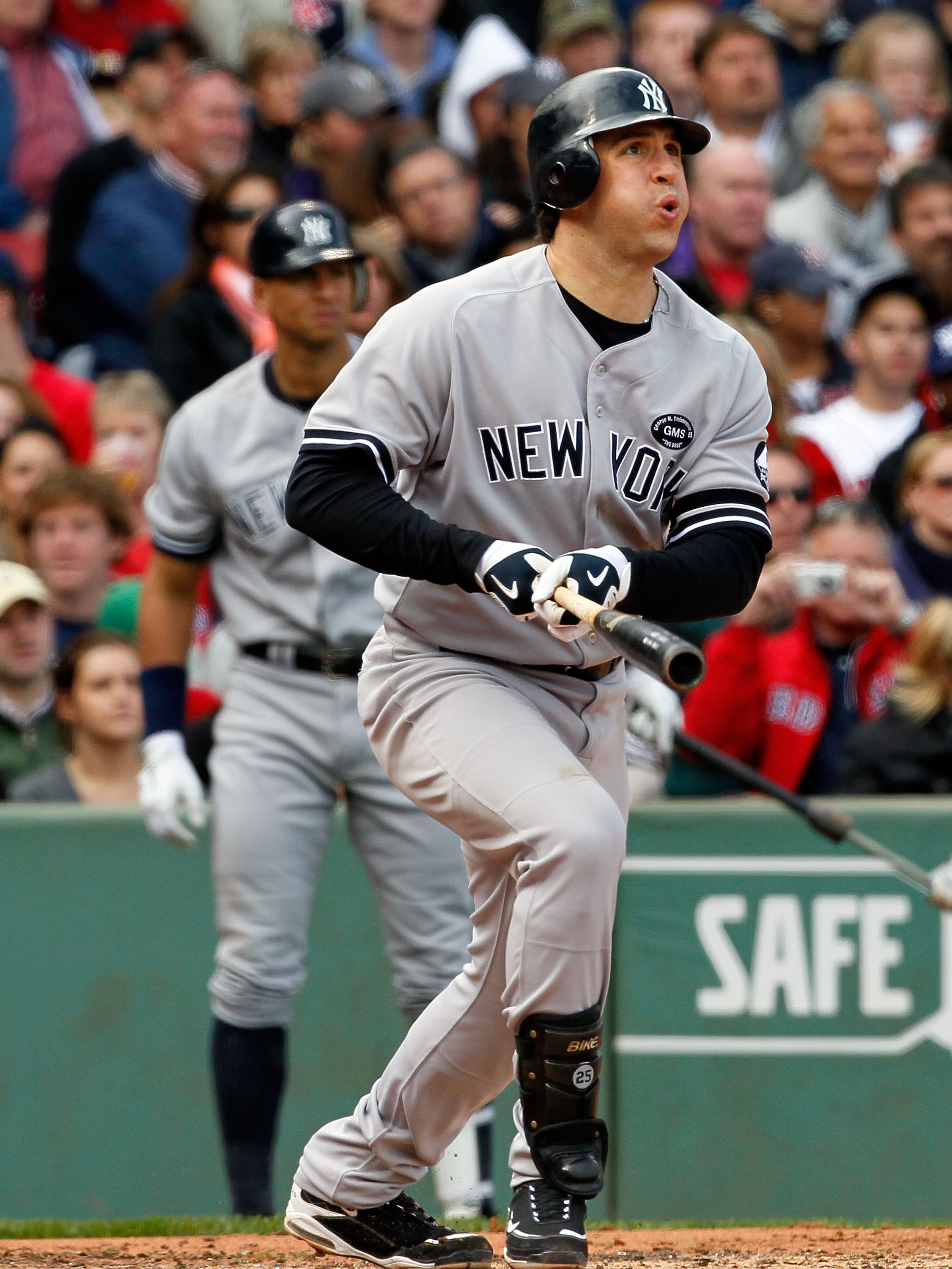 BOSTON - OCTOBER 3:  Mark Teixeira #25 of the New York Yankees watches the flight of a hit ball against the Boston Red Sox at Fenway Park October 3, 2010 in Boston, Massachusetts. (Photo by Jim Rogash/Getty Images)