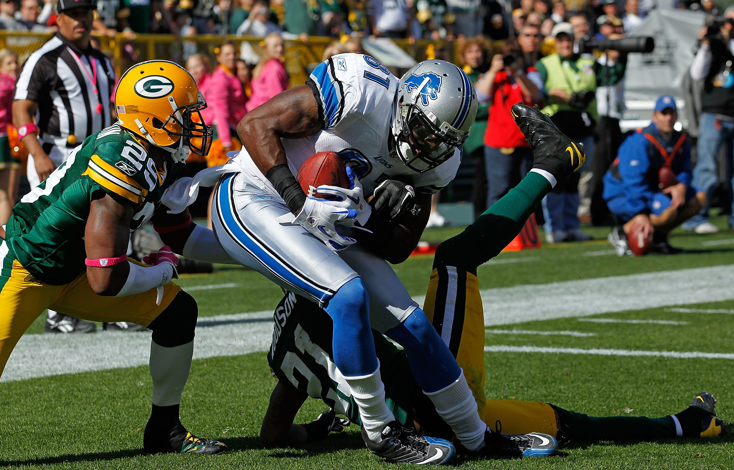 Detroit Lions tackle George Foster (72) and wide receiver Calvin Johnson  (81) look up at the scoreboard during the third quarter of an NFL football  game against the Houston Texans, Sunday, Oct.