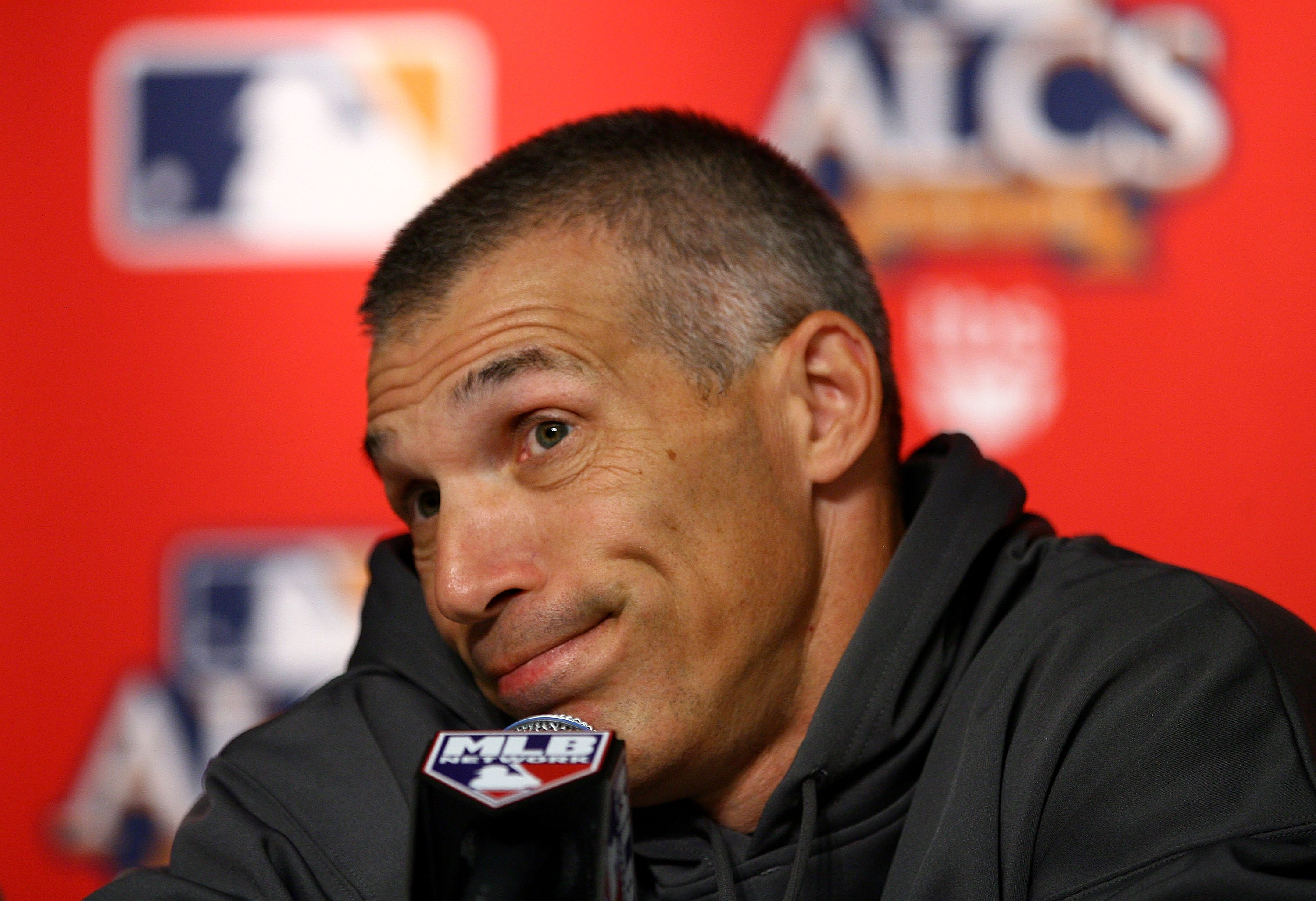 NEW YORK - OCTOBER 18:  Manager Joe Girardi of the New York Yankees speaks during his pregame press conference against the Texas Rangers prior to Game Three of the ALCS during the 2010 MLB Playoffs at Yankee Stadium on October 18, 2010 in New York, New Yo
