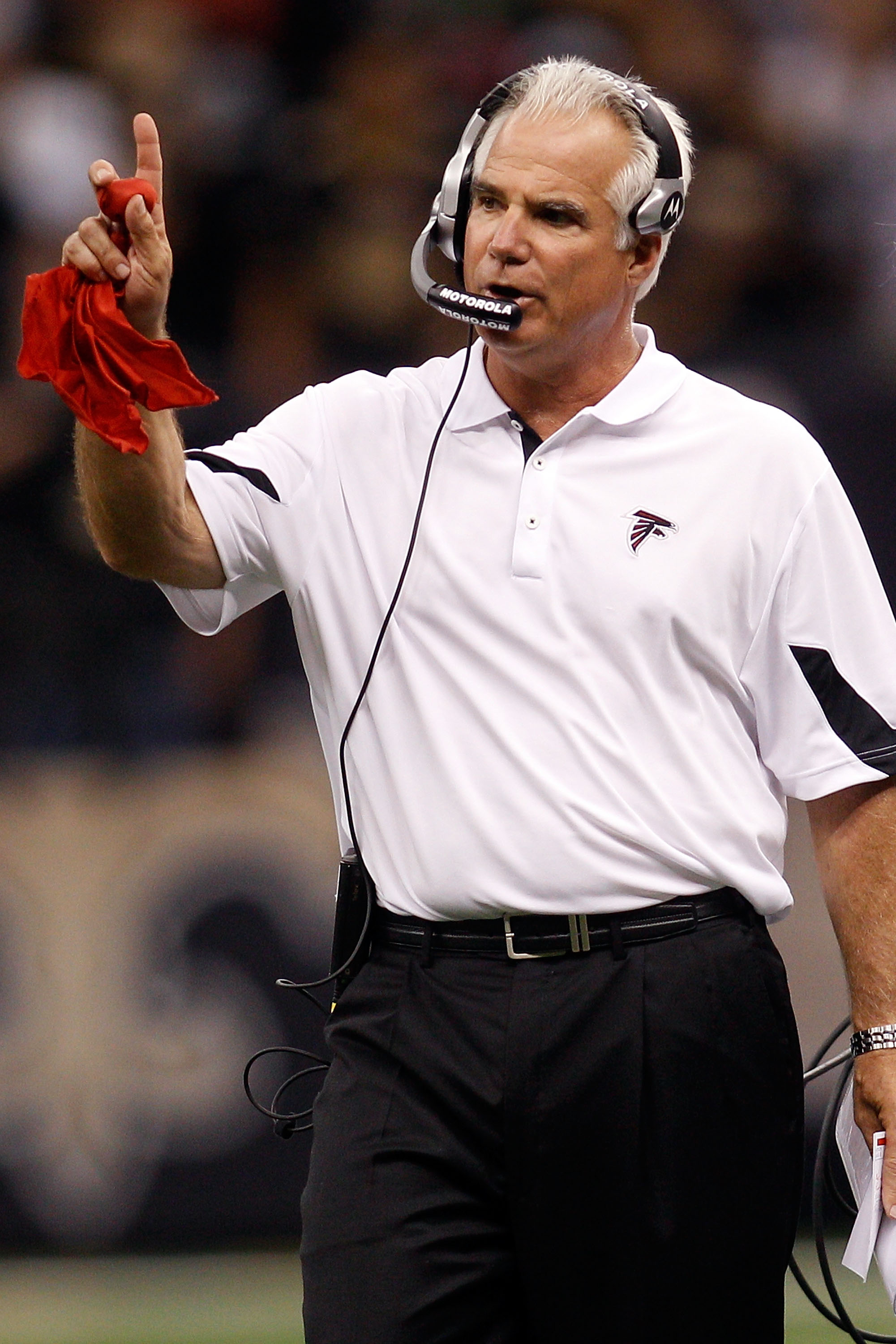 NEW ORLEANS - SEPTEMBER 26:  Head coach Mike Smith of the Atlanta Falcons throws out the red challenge flag during the game against the New Orleans Saints at the Louisiana Superdome on September 26, 2010 in New Orleans, Louisiana. The Falcons defeated the