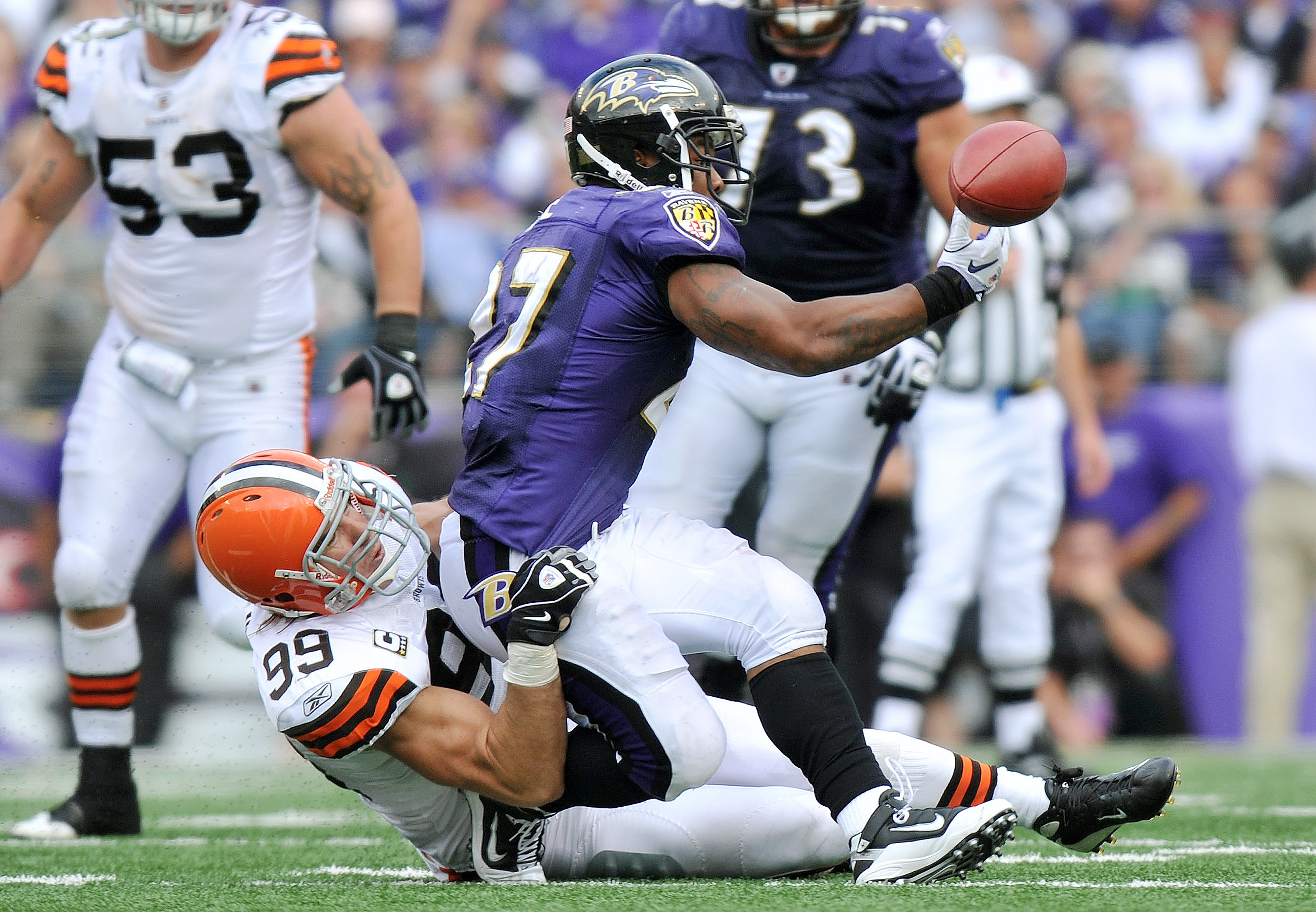 BALTIMORE - SEPTEMBER 26:  Ray Rice #27 of the Baltimore Ravens can't hold onto a pass as he's taken down by Scott Fujita #99 of the Cleveland Browns  at M&T Bank Stadium on September 26, 2010 in Baltimore, Maryland. The Ravens defeated the Browns 24-17.