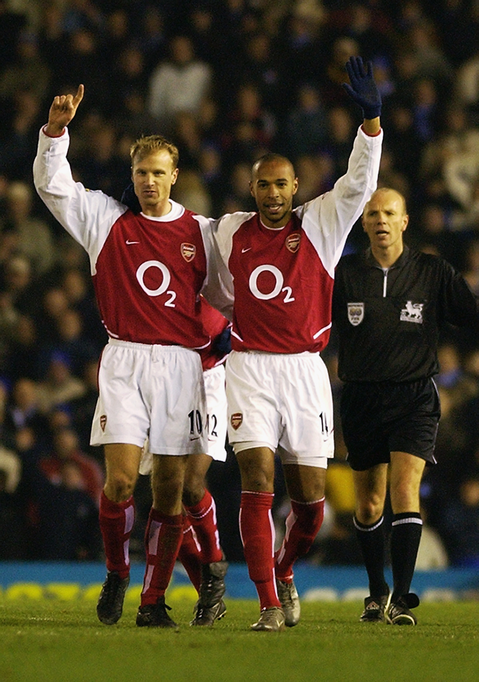 BIRMINGHAM - JANUARY 12:  Thierry Henry of Arsenal celebrates scoring his 100th goal for Arsenal with Dennis Bergkamp of Arsenal during the FA Barclaycard Premiership match between Birmingham City and Arsenal held on January 12, 2003 at St Andrews in Birm