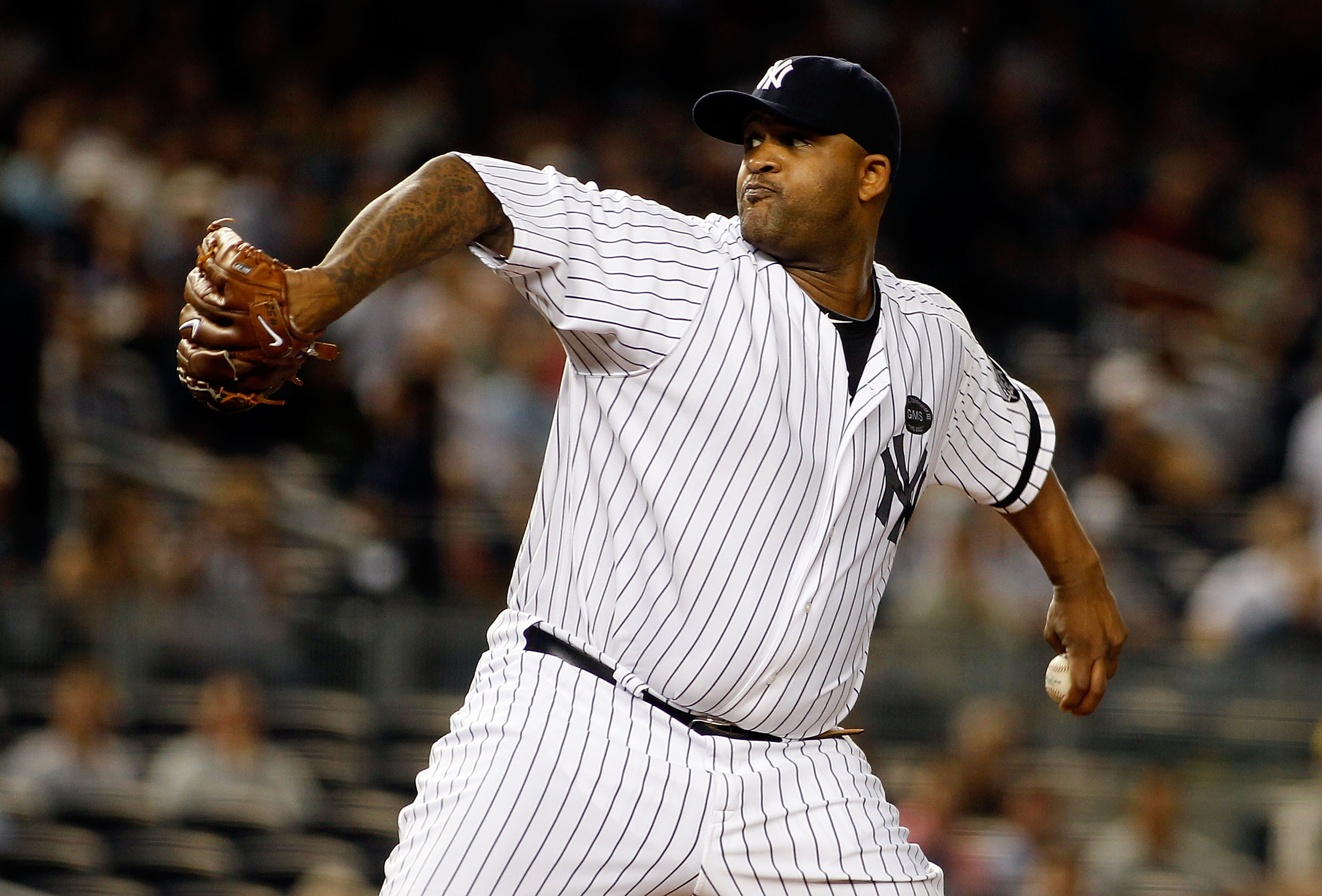 NEW YORK - SEPTEMBER 23:  CC Sabathia #52 of the New York Yankees delivers a pitch in the first-inning against the Tampa Bay Rays on September 23, 2010 at Yankee Stadium in the Bronx borough of New York City.  (Photo by Mike Stobe/Getty Images)