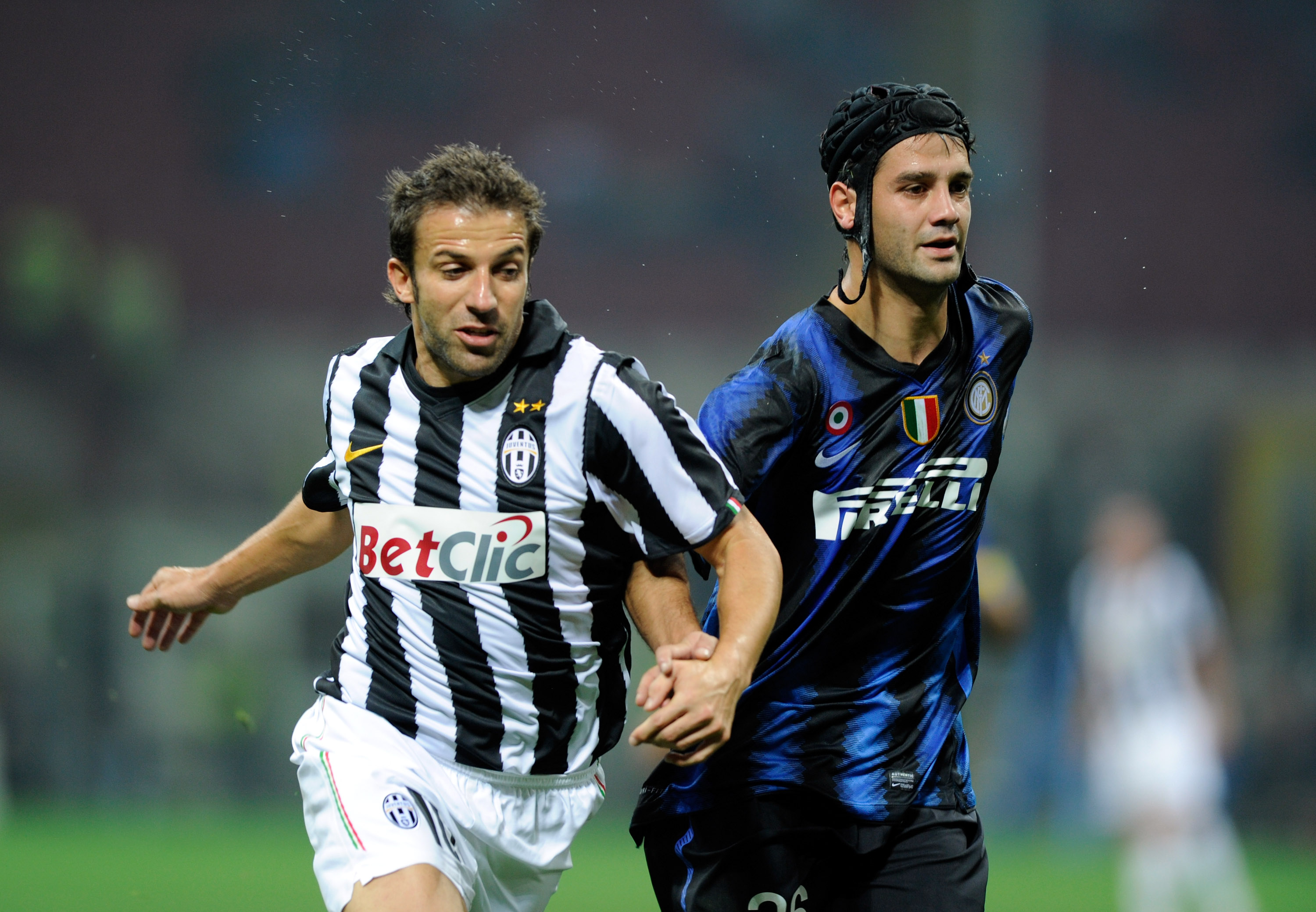 MILAN, ITALY - OCTOBER 03:  Christian Chivu of Inter Milan and Alessandro Del Piero of Juventus FC compete for the ball during the Serie A match between FC Internazionale Milano and Juventus FC at Stadio Giuseppe Meazza on October 3, 2010 in Milan, Italy.