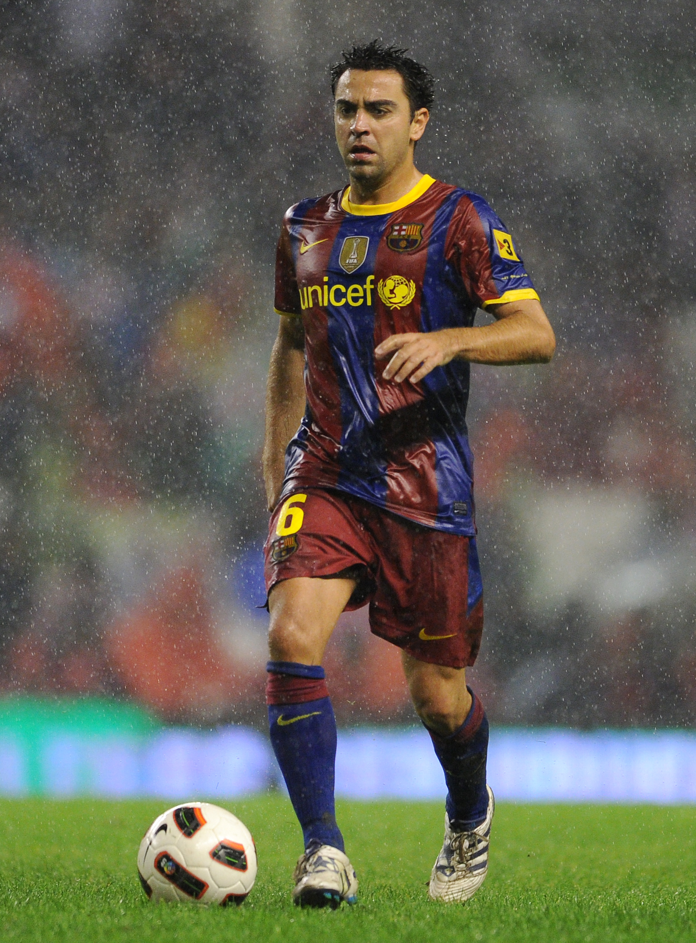 BILBAO, SPAIN - SEPTEMBER 25:  Xavi Hernandez of Barcelona runs with the ball during the La Liga match between Athletic Bilbao and Barcelona at the San Mames Stadium on September 25, 2010 in Bilbao, Spain. Barcelona won the match 3-1.  (Photo by Jasper Ju