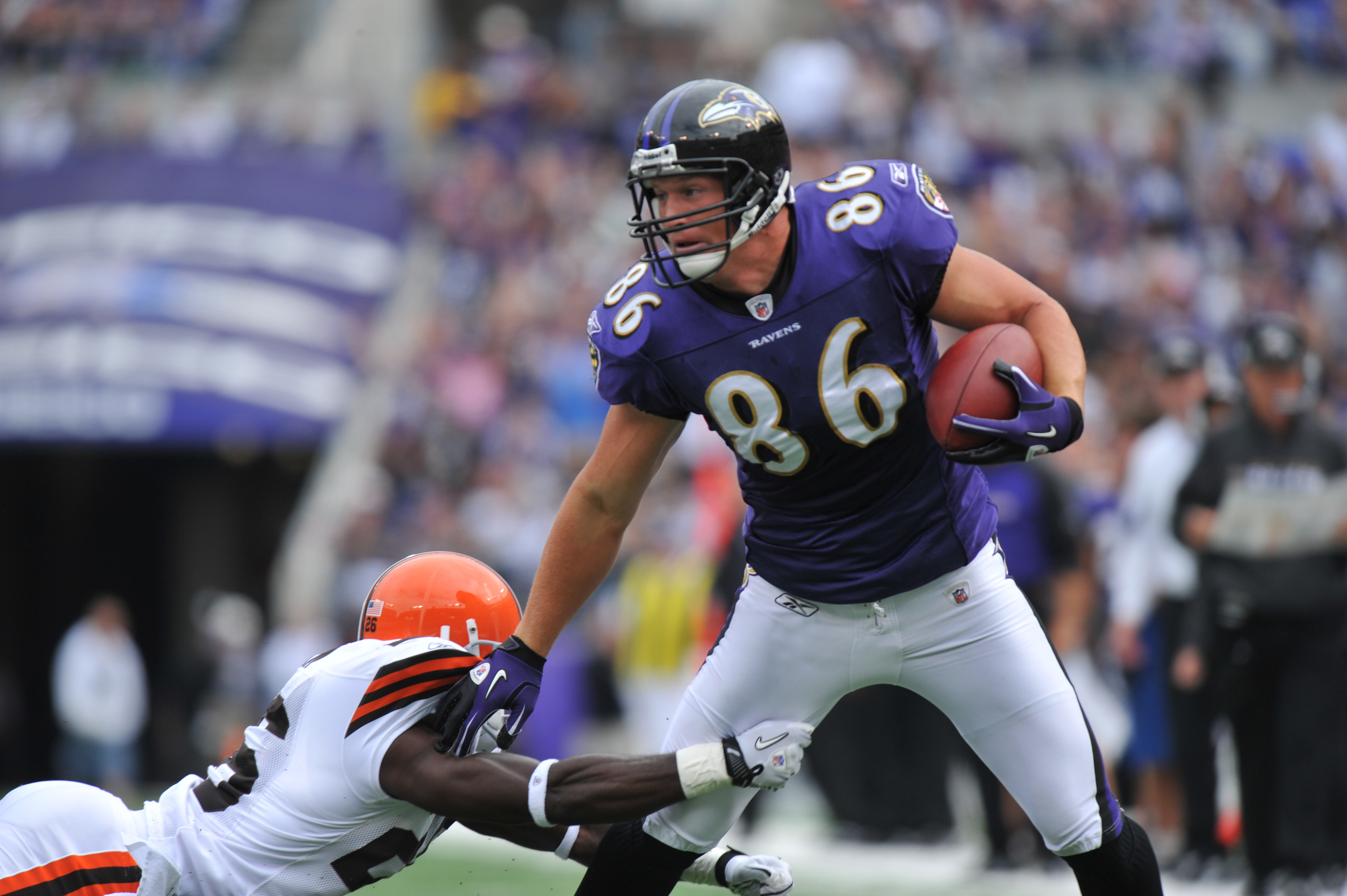 Photo: Ravens Todd Heap gains 4 yards against the Denver Broncos