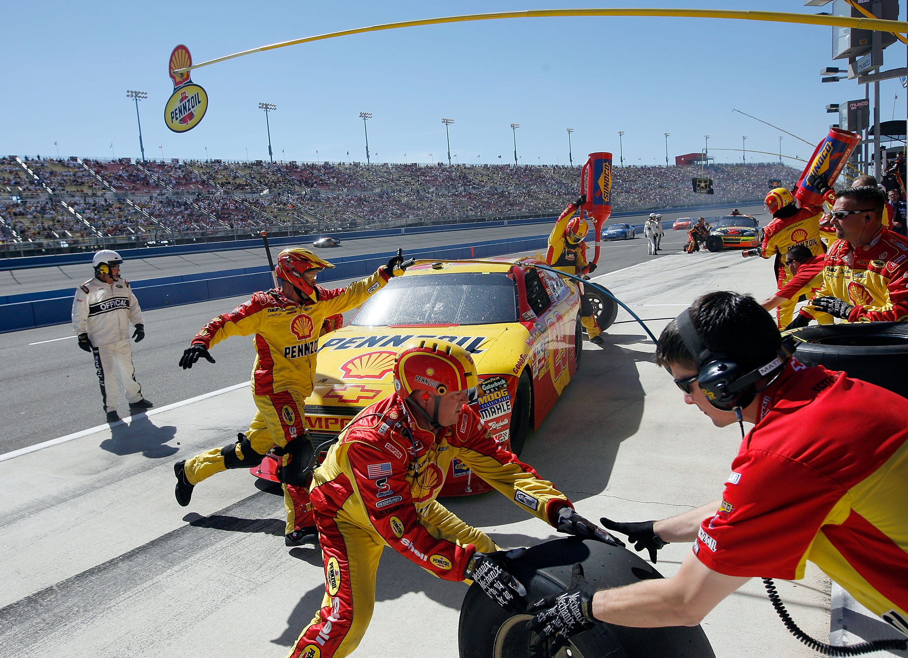 FONTANA, CA - OCTOBER 10:  Kevin Harvick, driver of the #29 Shell/Pennzoil Chevrolet, makes a pit stop during the NASCAR Sprint Cup Series Pepsi Max 400 on October 10, 2010 in Fontana, California.  (Photo by Tom Pennington/Getty Images for NASCAR)