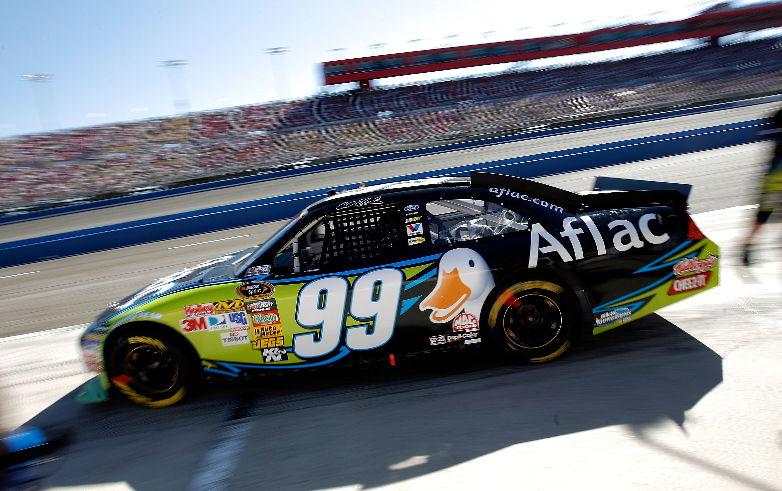 FONTANA, CA - OCTOBER 10:  Carl Edwards, driver of the #99 Aflac Ford, leaves the pits after making a stop during the NASCAR Sprint Cup Series Pepsi Max 400 on October 10, 2010 in Fontana, California.  (Photo by Tom Pennington/Getty Images for NASCAR)