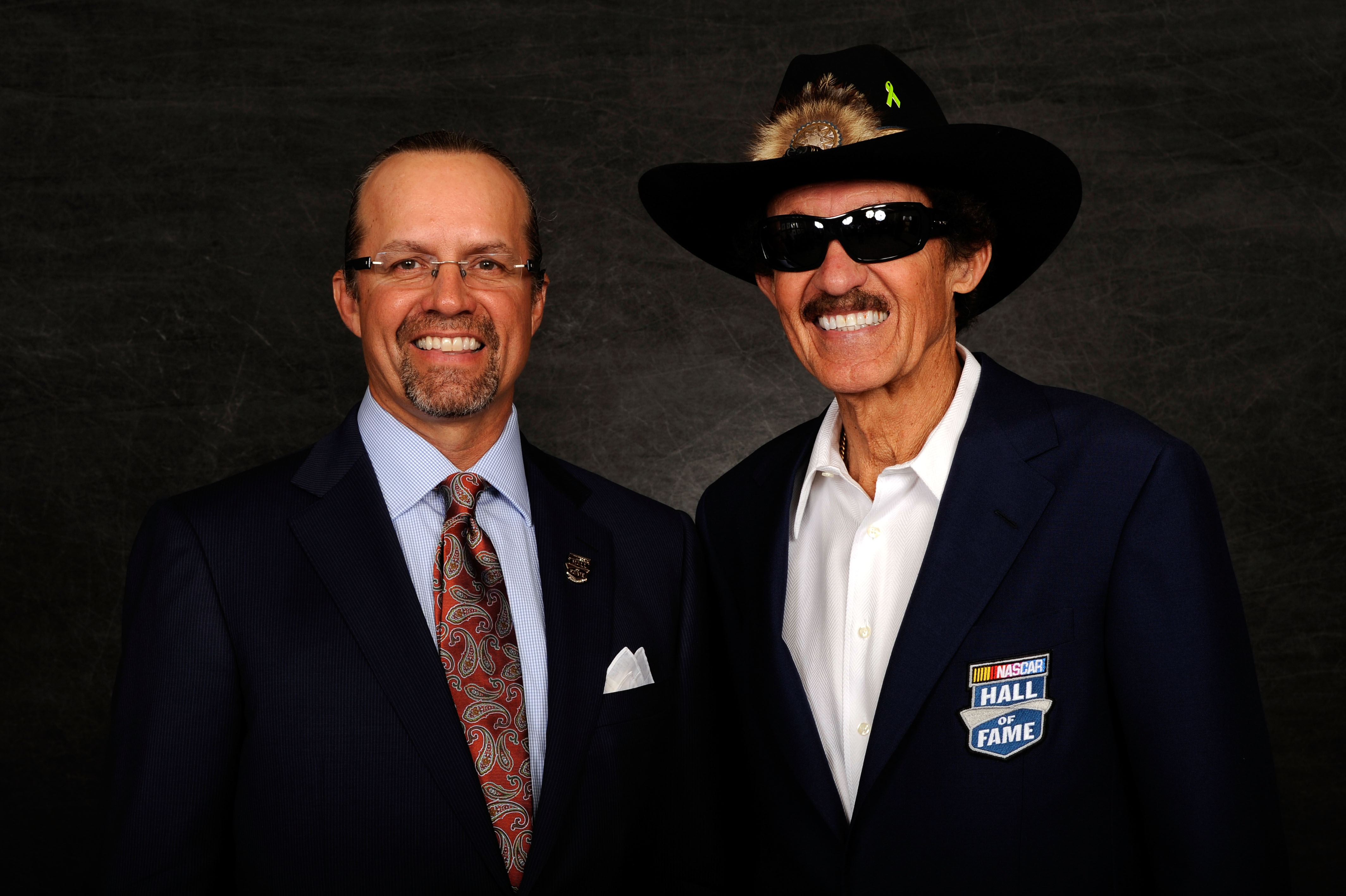 CHARLOTTE, NC - MAY 23:  Hall of Fame inductee Richard Petty (R) and his son Kyle Petty pose prior to the 2010 NASCAR Hall of Fame Induction Ceremony at The Ritz-Carlton on May 23, 2010 in Charlotte, North Carolina.  (Photo by Rusty Jarrett/Getty Images f