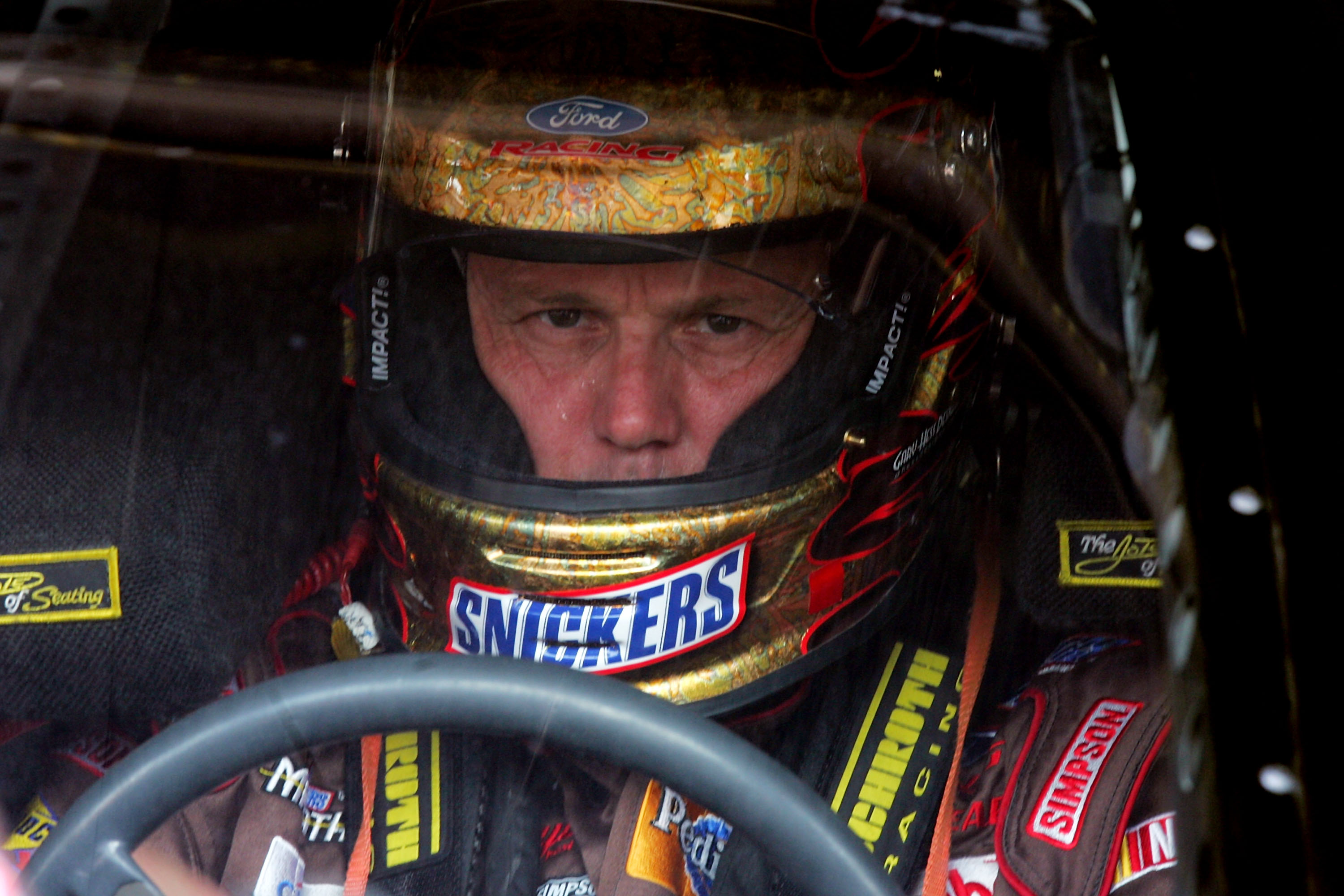 DOVER, DE - JUNE 01: Ricky Rudd, driver of the #88 Snickers Ford, sits in his car during practice for the NASCAR Nextel Cup Series Autism Speaks 400 on June 1, 2007 at Dover International Speedway in Dover, Delaware.  (Photo by Chris McGrath/Getty Images)