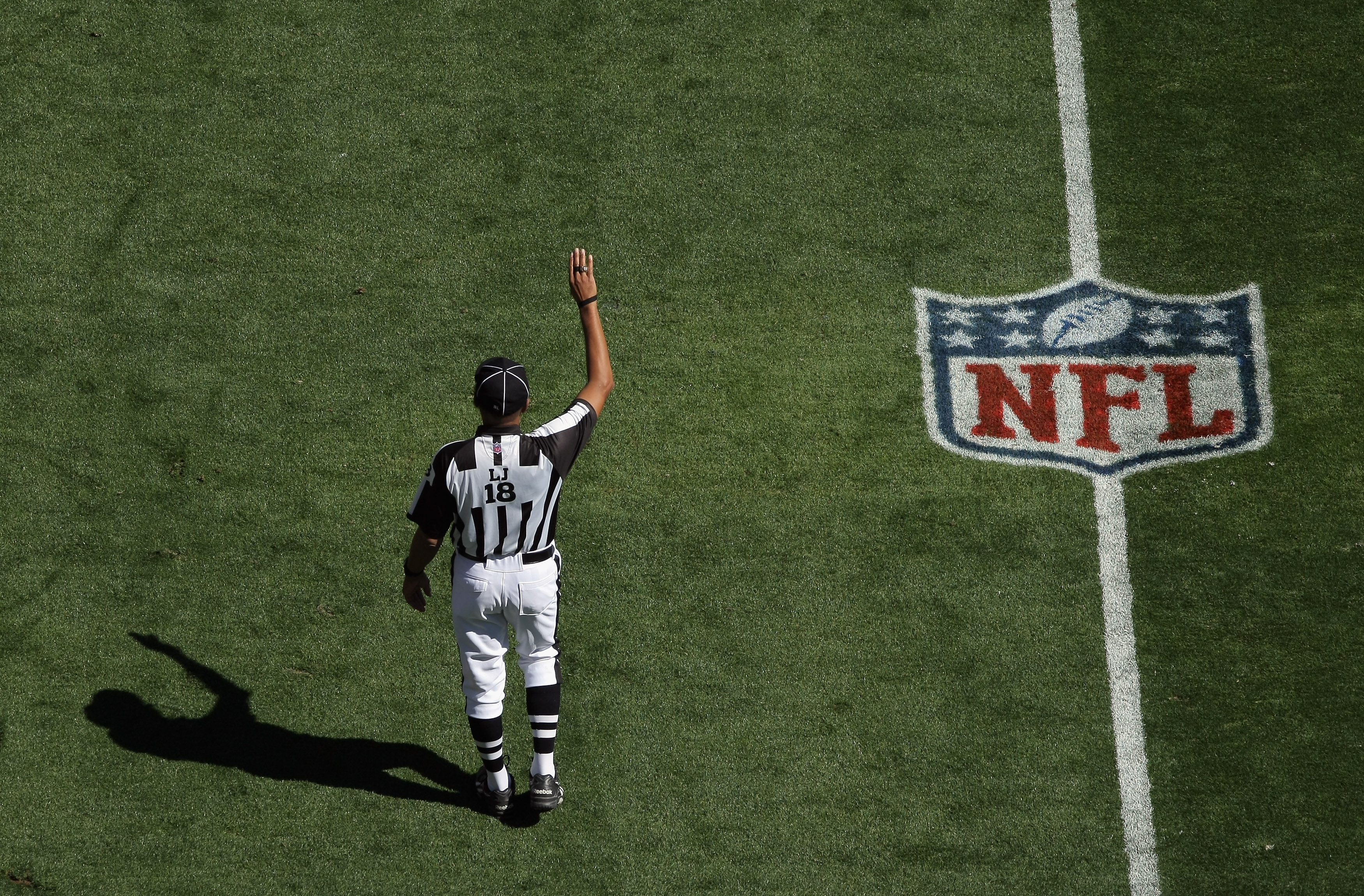 DENVER - SEPTEMBER 19: Line judge Byron Boston oversees the action as the Seattle Seahawks face the Denver Broncos at INVESCO Field at Mile High on September 19, 2010 in Denver, Colorado The Broncos defeated the Seahawks 31-14.. (Photo by Doug Pensinger