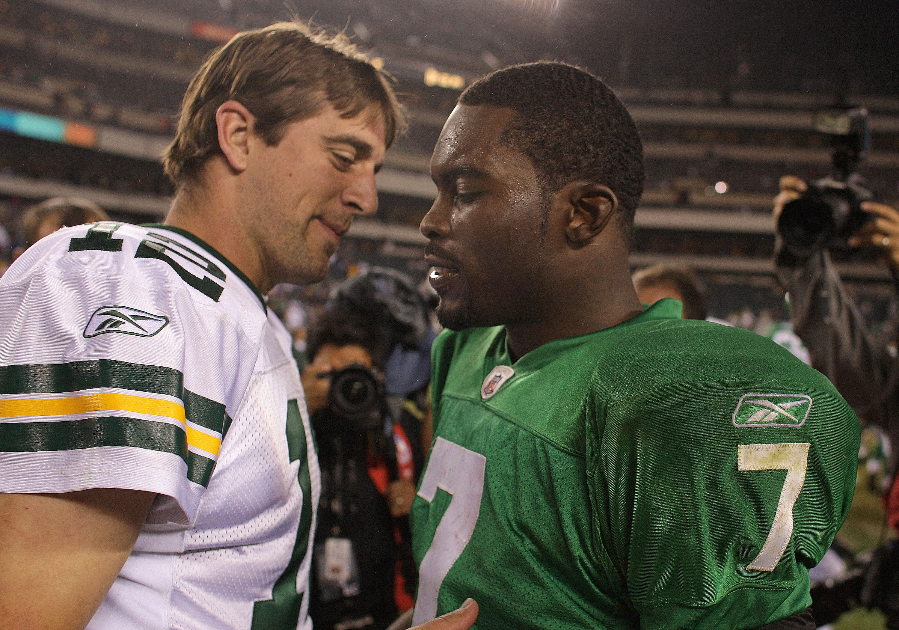 PHILADELPHIA - SEPTEMBER 12: Michael Vick #7 of the Philadelphia Eagles walks off the field and greets Aaron Rodgers #12 after a loss in a game against the Green Bay Packers at Lincoln Financial Field on September 12, 2010 in Philadelphia, Pennsylvania.