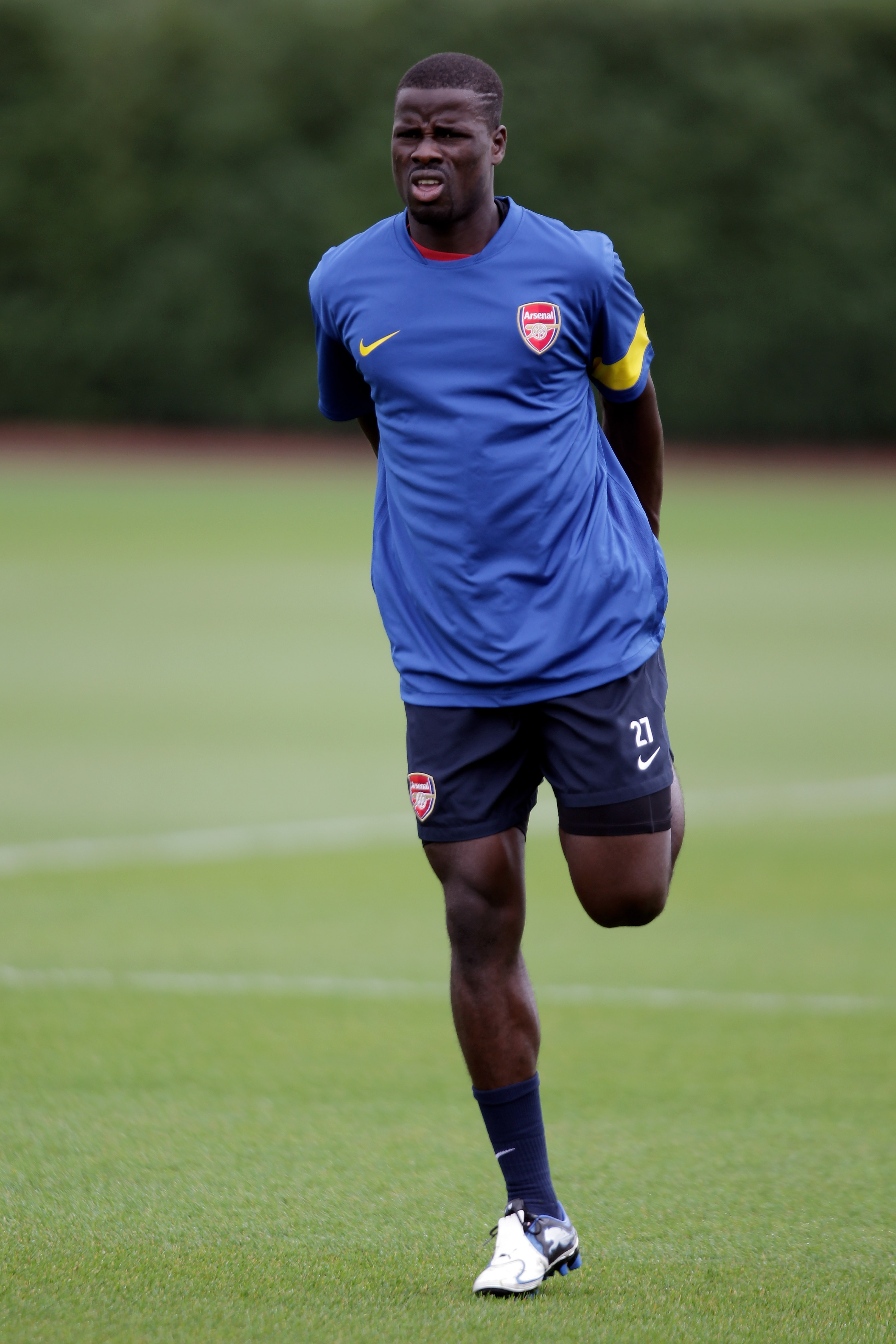 ST ALBANS, ENGLAND - SEPTEMBER 27:  Emmanuel Eboue warms up during a training session ahead of the UEFA Champions League game against Partizan Belgrade at the club's complex at London Colney on September 27, 2010 in St Albans, England.  (Photo by Dean Mou