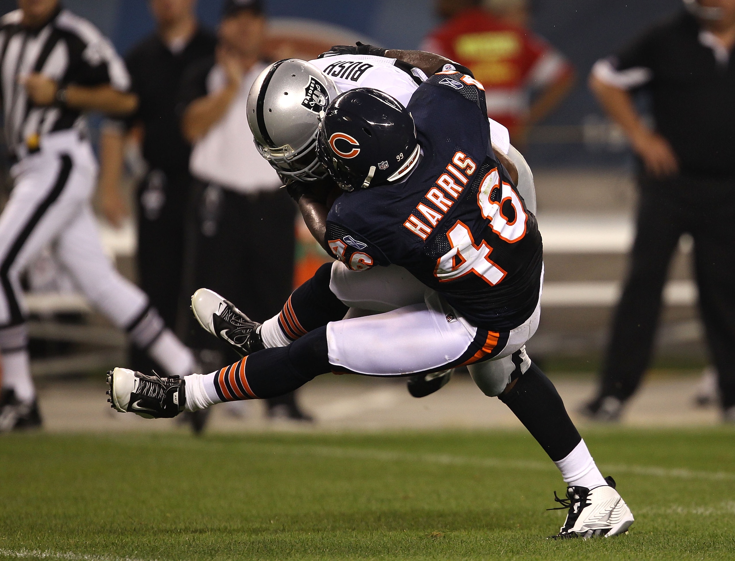 CHICAGO - AUGUST 21: Chris Harris #46 of the Chicago Bears goes airbourne to tackle Michael Bush #29 of the Oakland Raiders during a preseason game at Soldier Field on August 21, 2010 in Chicago, Illinois. The Raiders defeated the Bears 32-17. (Photo by J CHICAGO - AUGUST 21: Chris Harris #46 of the Chicago Bears goes airbourne to tackle Michael Bush #29 of the Oakland Raiders during a preseason game at Soldier Field on August 21, 2010 in Chicago, Illinois. The Raiders defeated the Bears 32-17. (Photo by J