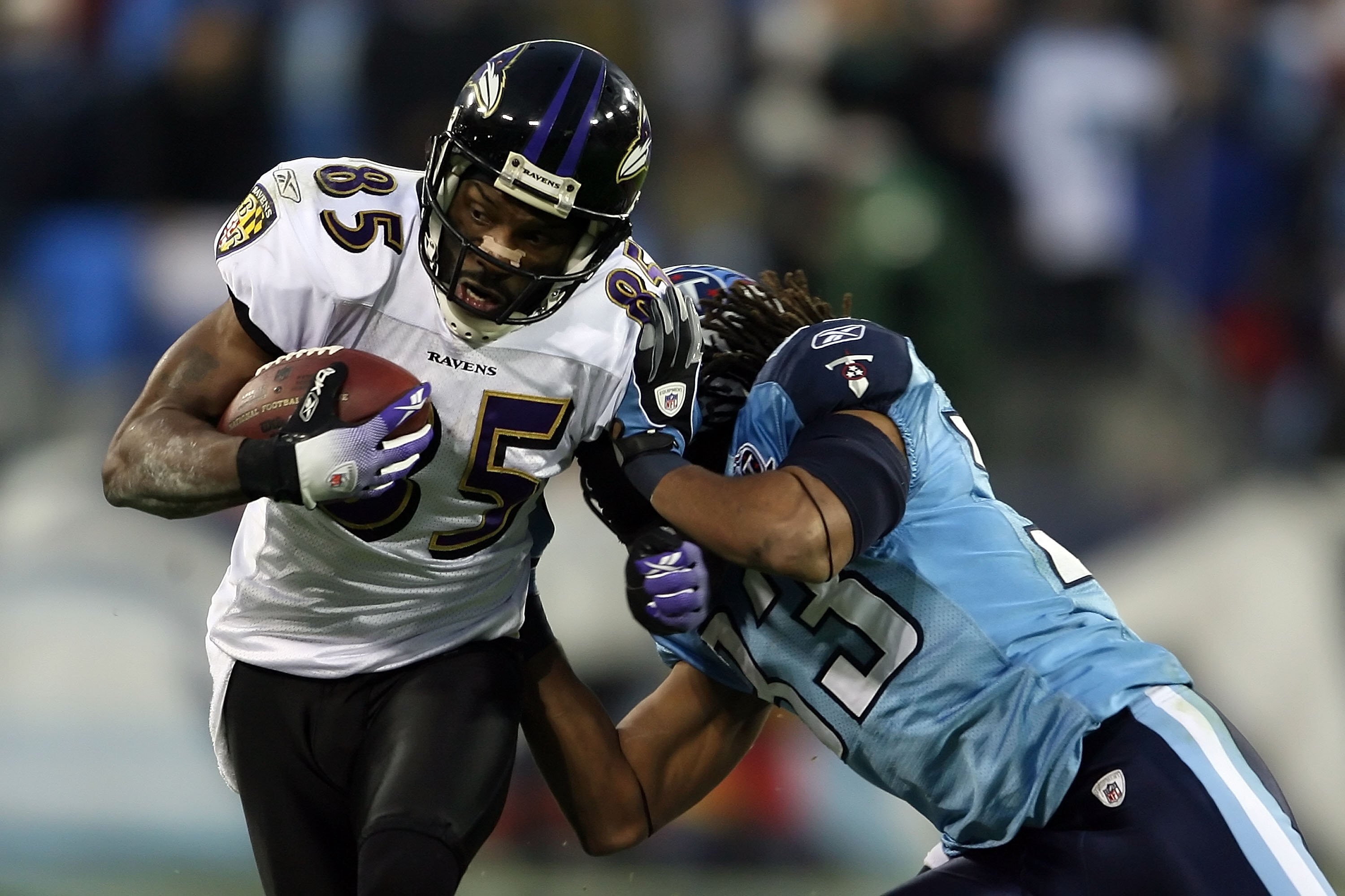 NASHVILLE, TN - JANUARY 10:  Wide receiver Derrick Mason #85 of the Baltimore Ravens is hit by safety Michael Griffin #33 of the Tennessee Titans during the AFC Divisional Playoff Game on January 10, 2009 at LP Field in Nashville, Tennessee.  (Photo by An