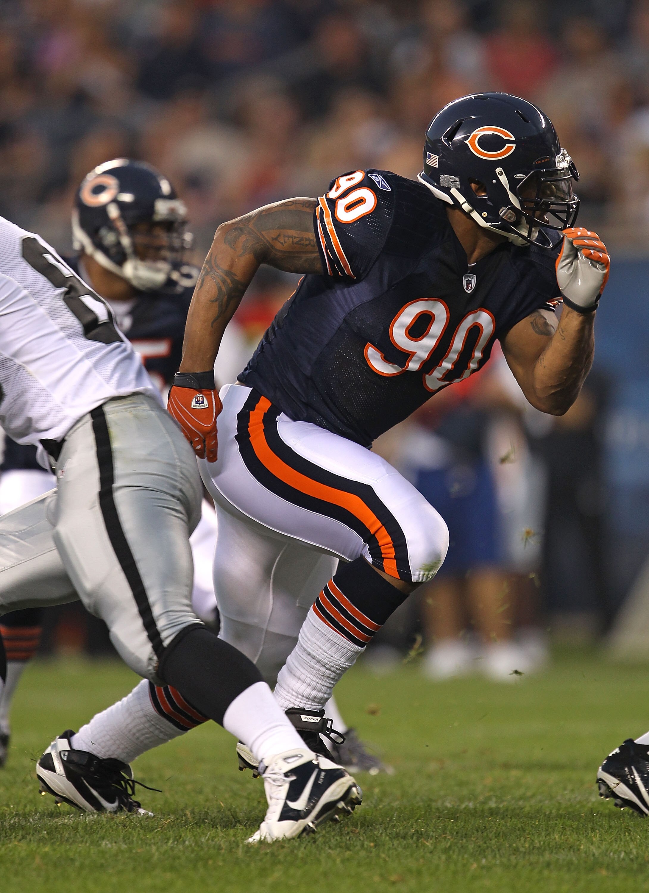 CHICAGO - AUGUST 21: Julius Peppers #90 of the Chicago Bears rushes against the Oakland Raiders during a preseason game at Soldier Field on August 21, 2010 in Chicago, Illinois. The Radiers defeated the Bears 32-17. (Photo by Jonathan Daniel/Getty Images)