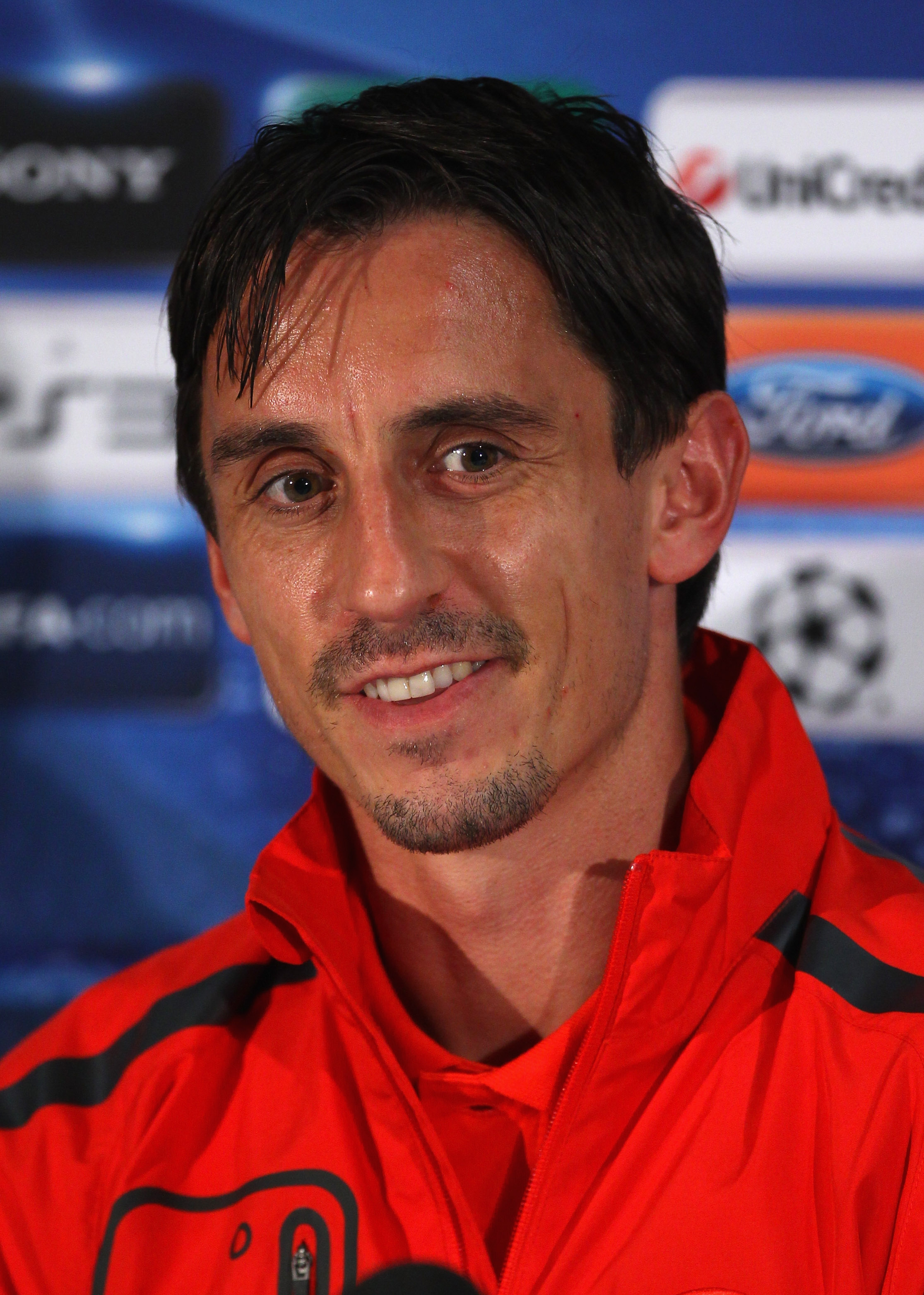 MANCHESTER, ENGLAND - SEPTEMBER 13:  Gary Neville of Manchester United faces the media during a press conference ahead of their UEFA Champions League match against Rangers held at Carrington Training Ground on September 13, 2010 in Manchester, England.  (