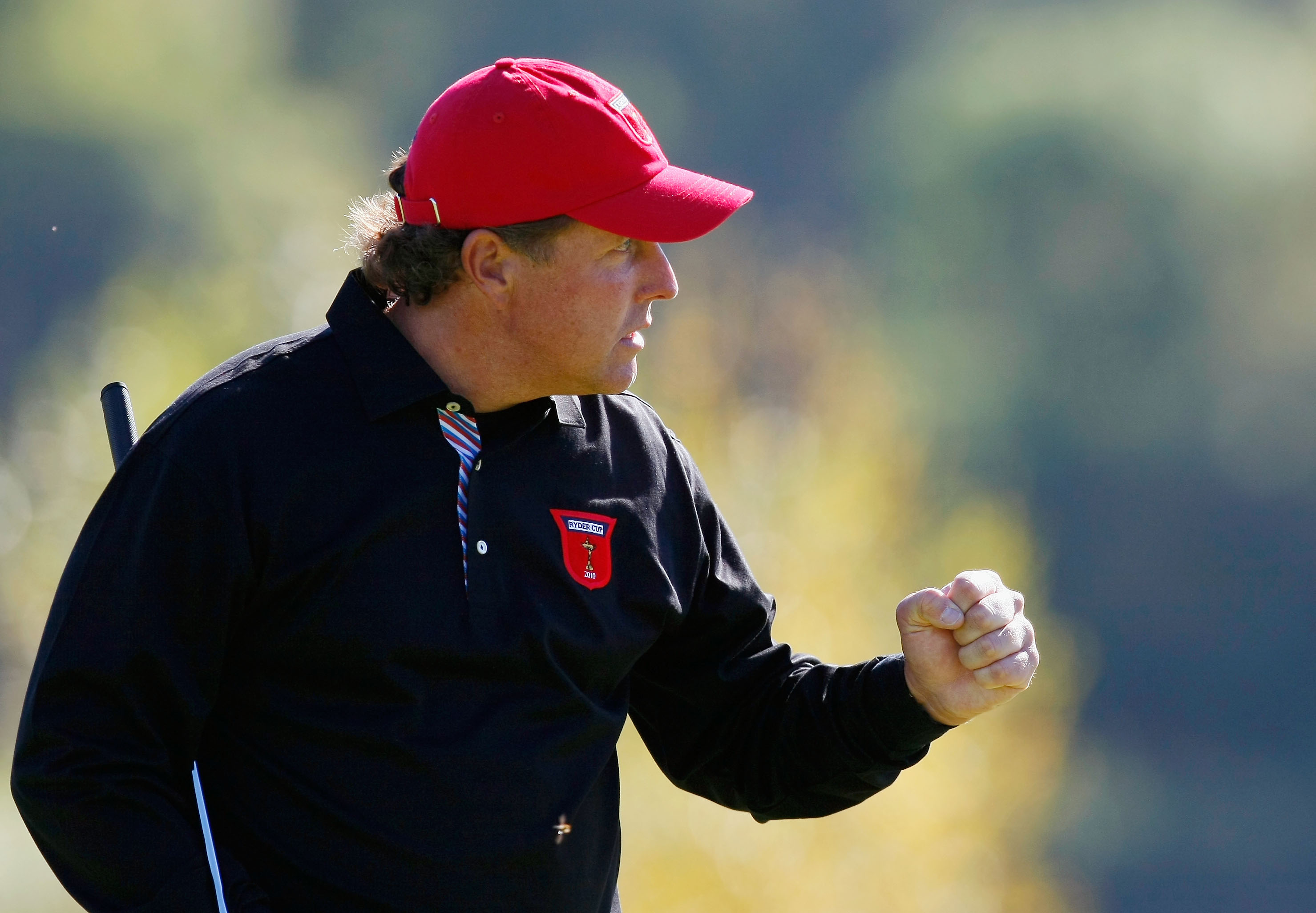 NEWPORT, WALES - OCTOBER 04:  Phil Mickelson of the USA celebrates holing a putt in the singles matches during the 2010 Ryder Cup at the Celtic Manor Resort on October 4, 2010 in Newport, Wales.  (Photo by Tom Dulat/Getty Images)