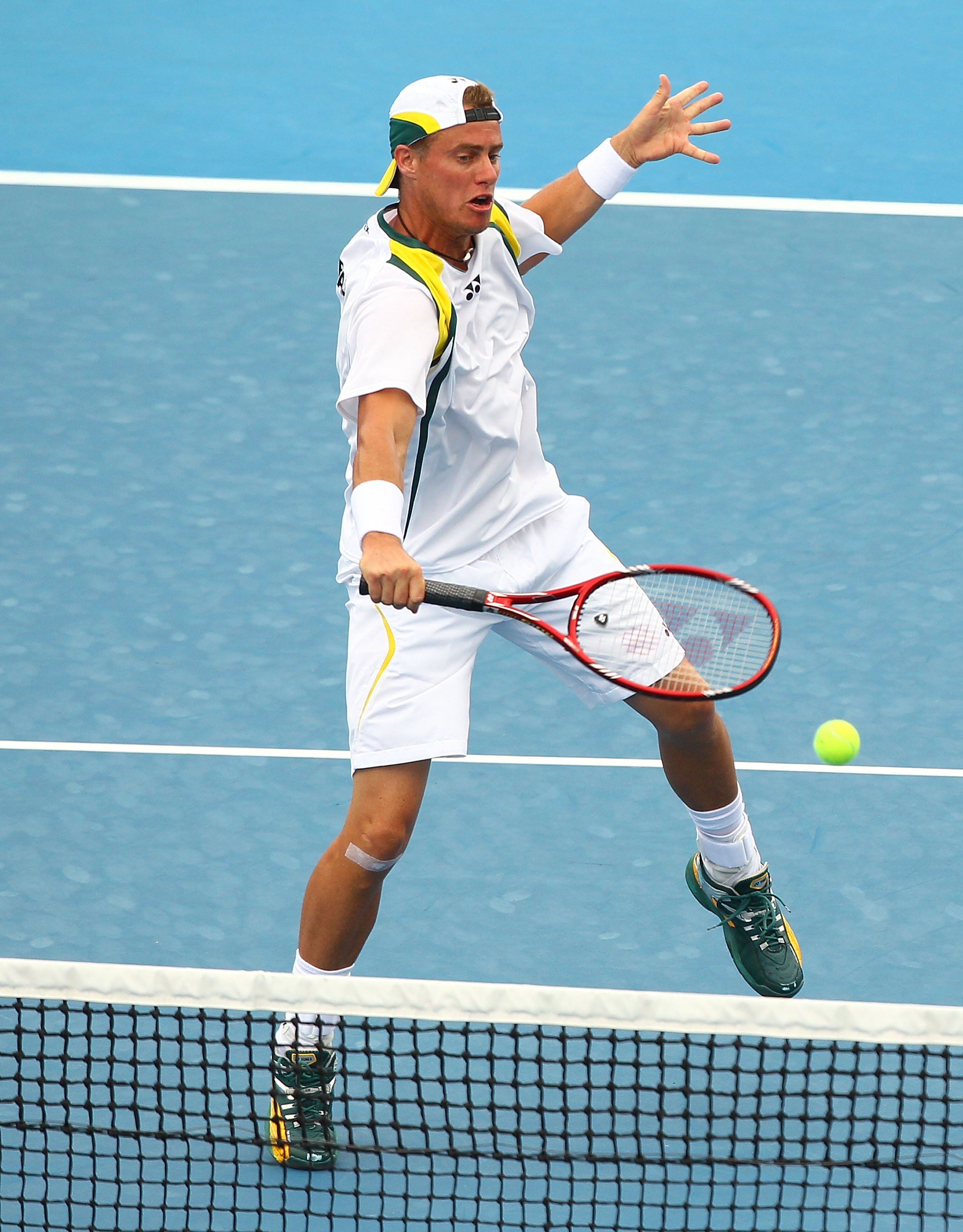CAIRNS, AUSTRALIA - SEPTEMBER 18:  Lleyton Hewitt of Australia returns a shot during the doubles match against Olivier Rochus and Ruben Bemelmans of Belgium during day two of the Davis Cup tie between Australia and Belgium at Cairns International Tennis C