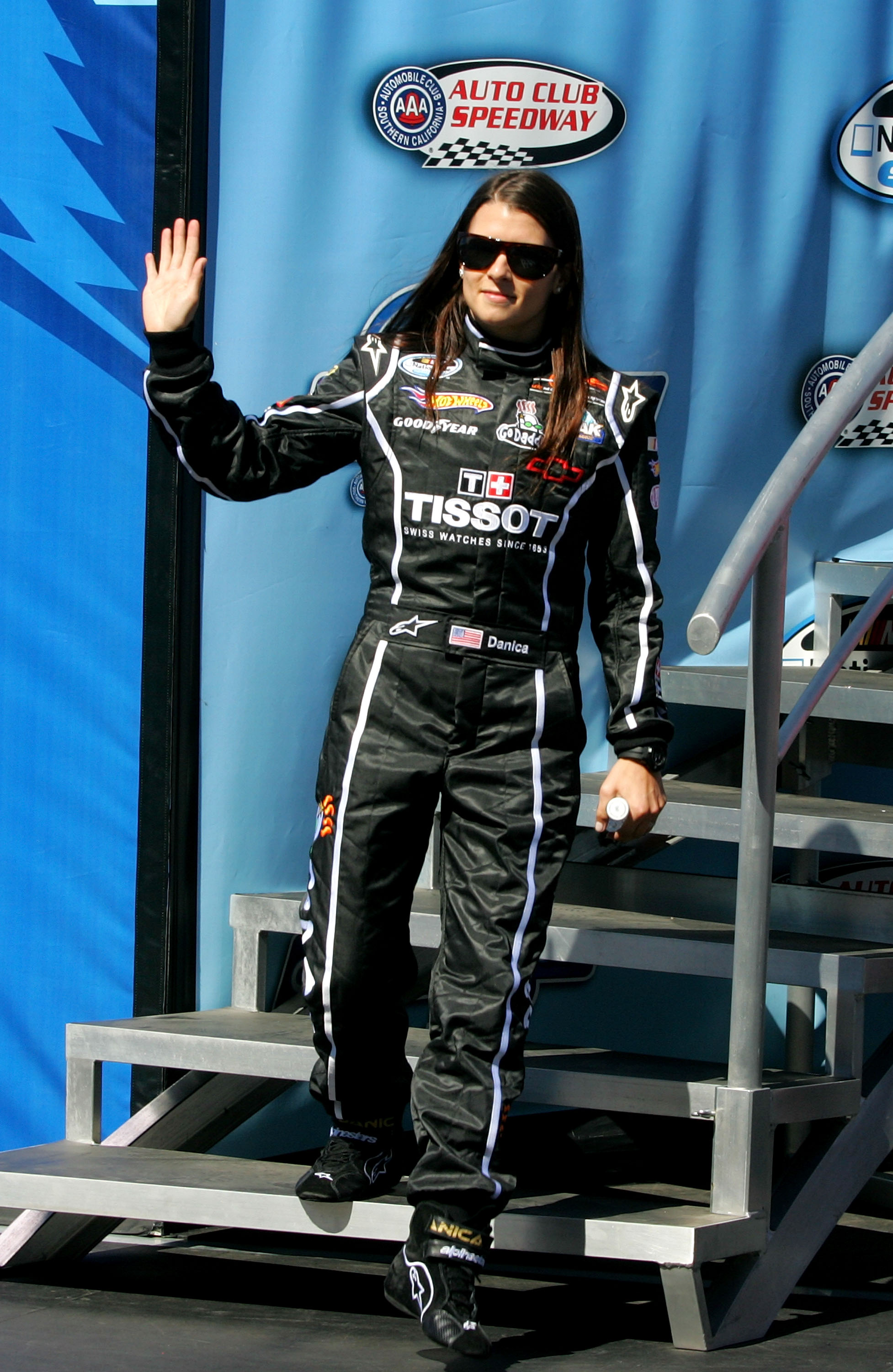 FONTANA, CA - OCTOBER 09: Danica Patrick, driver of the #7 Tissot/GoDaddy.com Chevrolet waves during driver introductions for the NASCAR Nationwide Series CampingWorld.com 300 on October 9, 2010 in Fontana, California.  (Photo by Jerry Markland/Getty Imag
