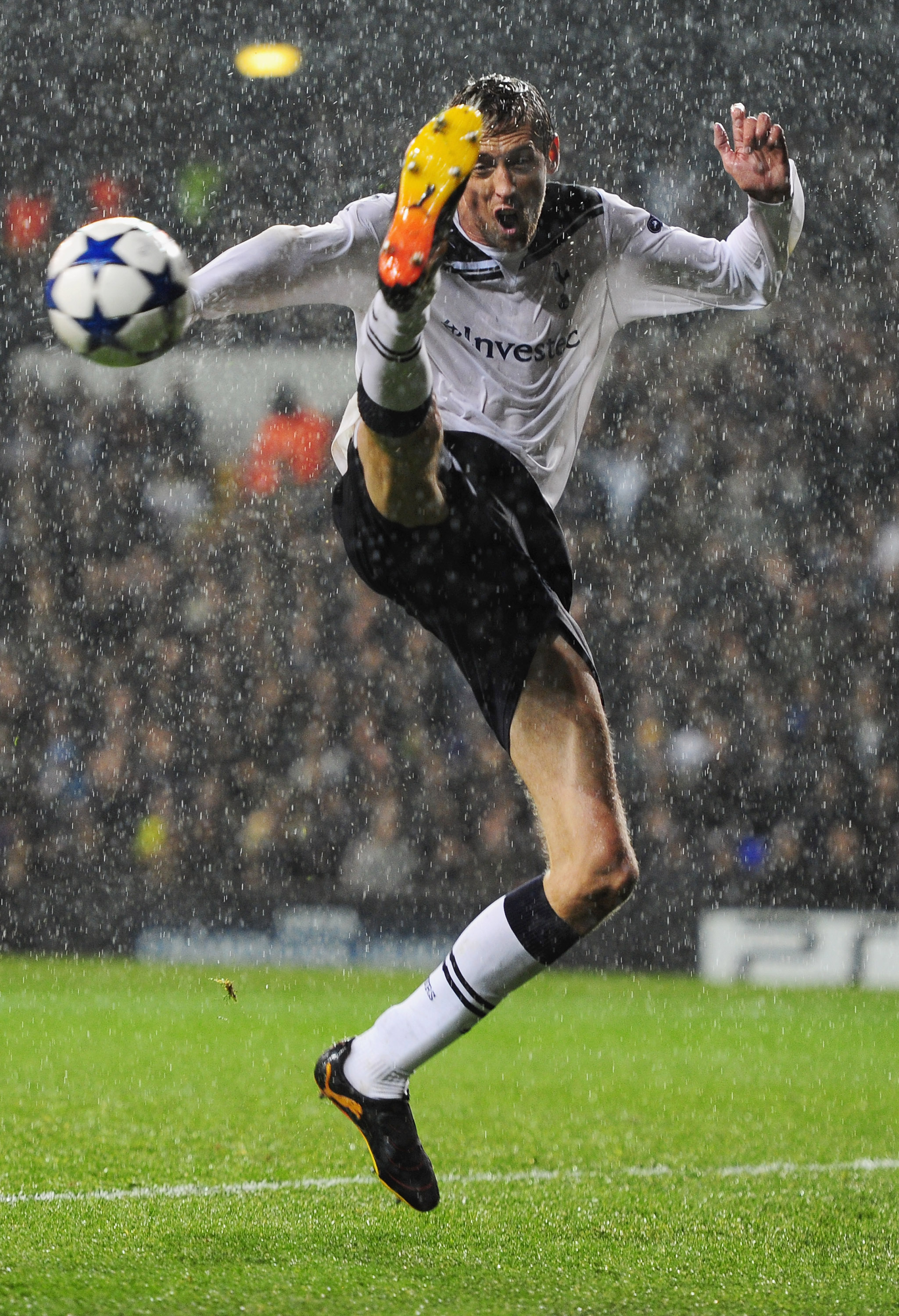 LONDON, ENGLAND - SEPTEMBER 29:  Peter Crouch of Tottenham attempts to control the ball in the rain during the  UEFA Champions League Group A match between Tottenham Hotspur and FC Twente at White Hart Lane on September 29, 2010 in London, England.  (Phot