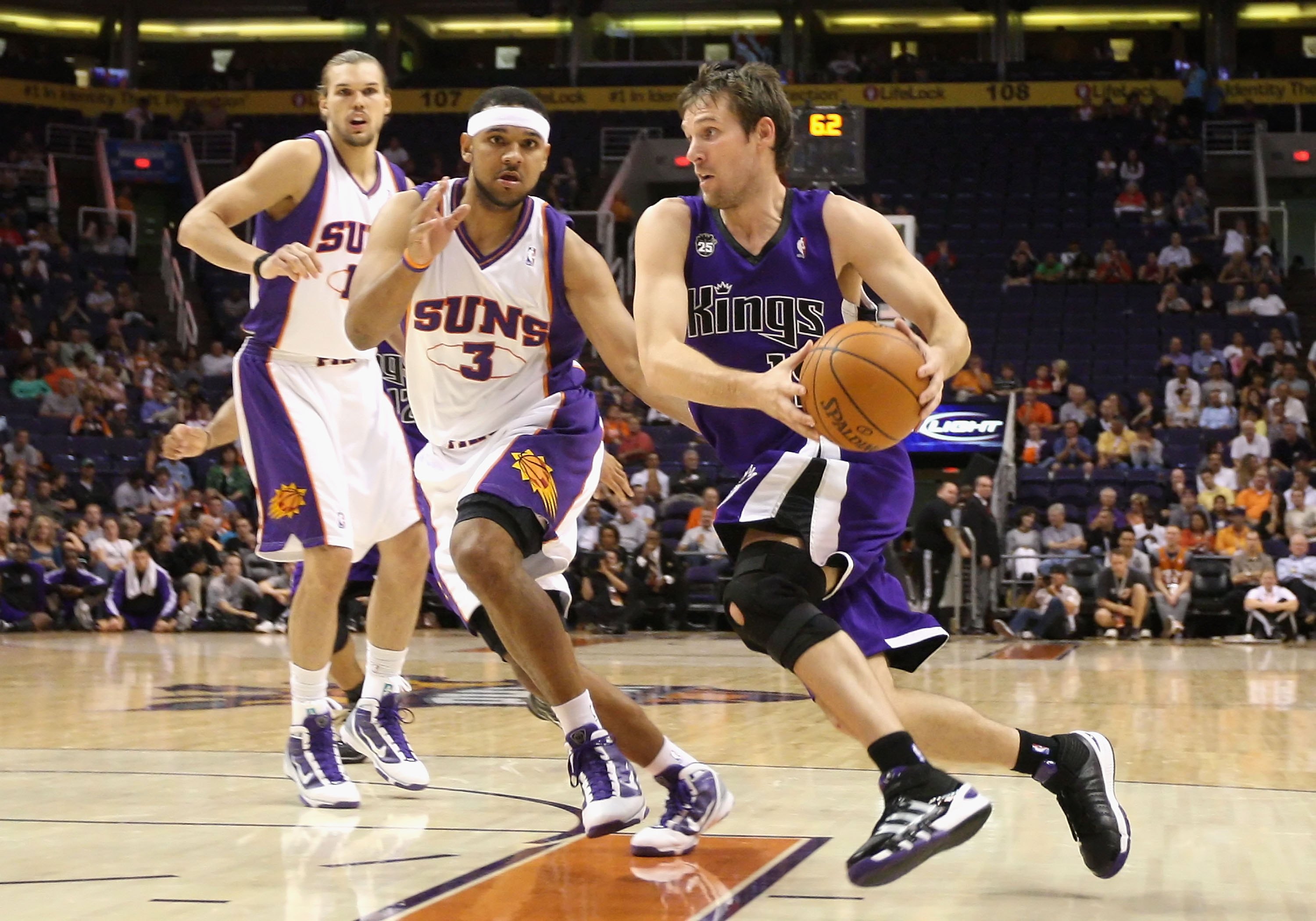 PHOENIX - OCTOBER 20:  Beno Udrih #19 of the Sacramento Kings drives the ball past Jared Dudley #3 of the Phoenix Suns during the NBA preseason game at US Airways Center on October 20, 2009 in Phoenix, Arizona. The Suns defeated the Kings 143-127.  NOTE T