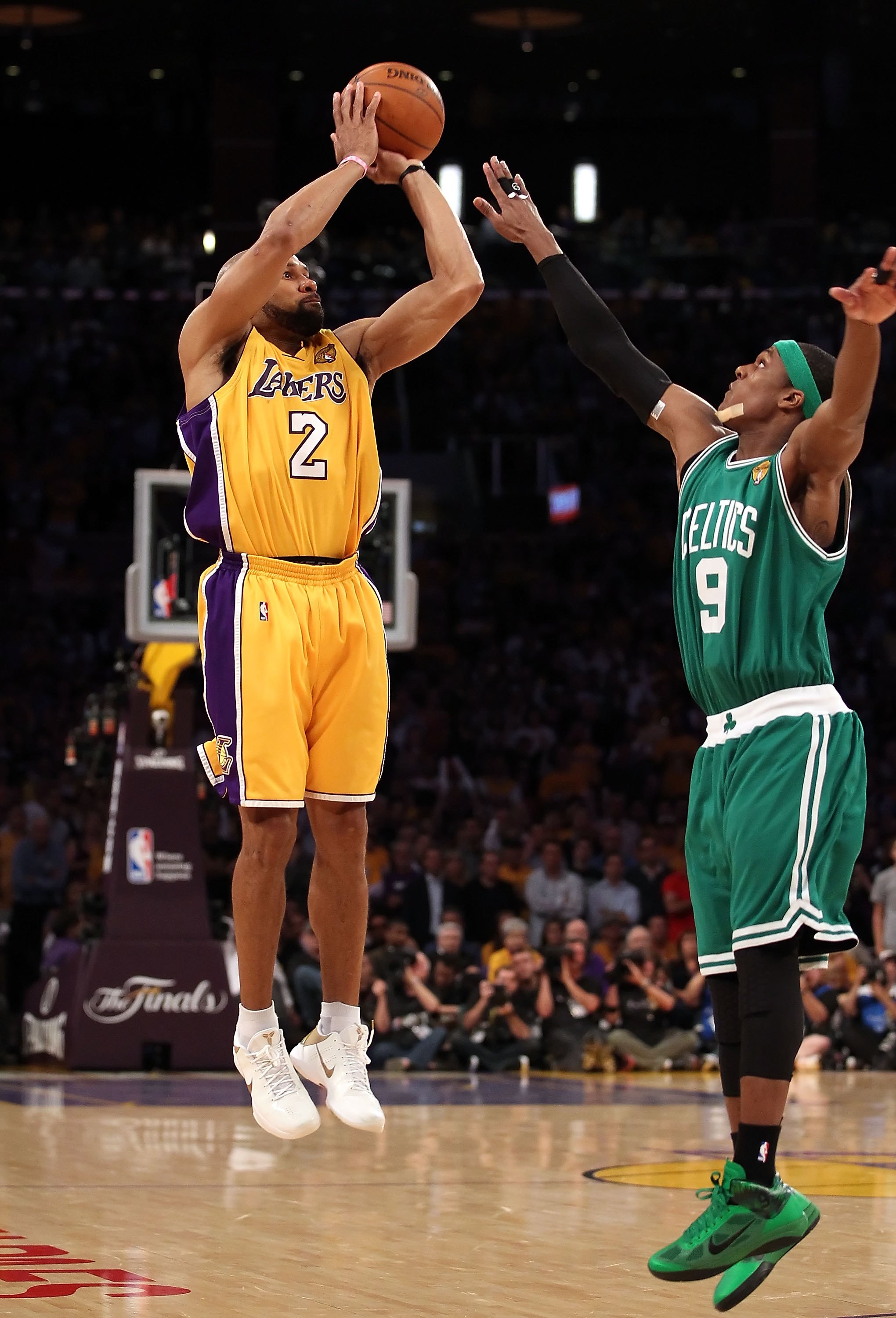 LOS ANGELES, CA - JUNE 17:  Derek Fisher #2 of the Los Angeles Lakers puts up a three point shot over Rajon Rondo #9 of the Boston Celtics in Game Seven of the 2010 NBA Finals at Staples Center on June 17, 2010 in Los Angeles, California.  The Lakers defe