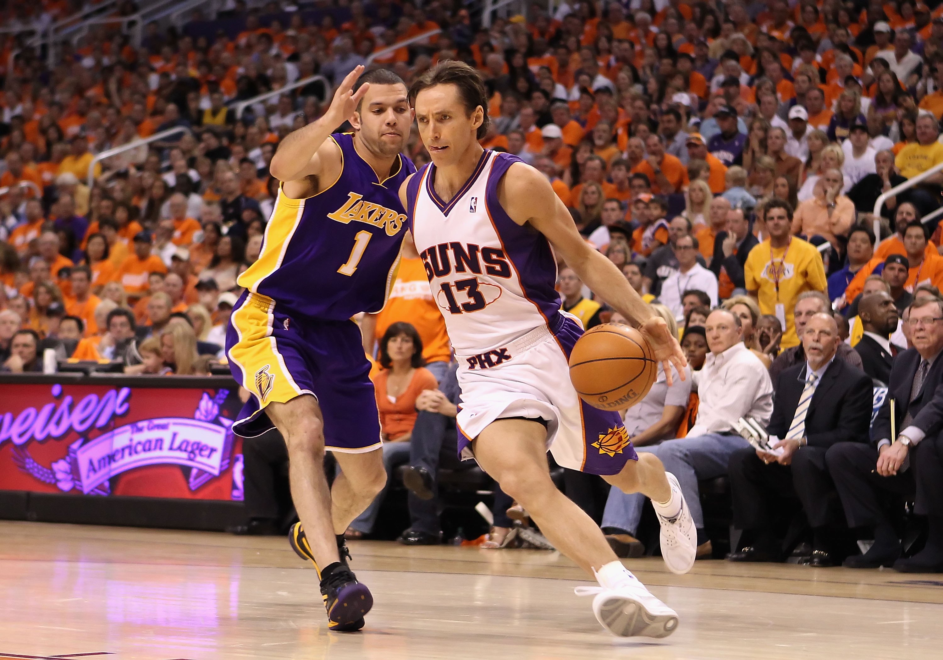 PHOENIX - MAY 23:  Steve Nash #13 of the Phoenix Suns handles the ball under pressure from Jordan Farmar #1 of the Los Angeles Lakers during Game Three of the Western Conference finals of the 2010 NBA Playoffs at US Airways Center on May 23, 2010 in Phoen