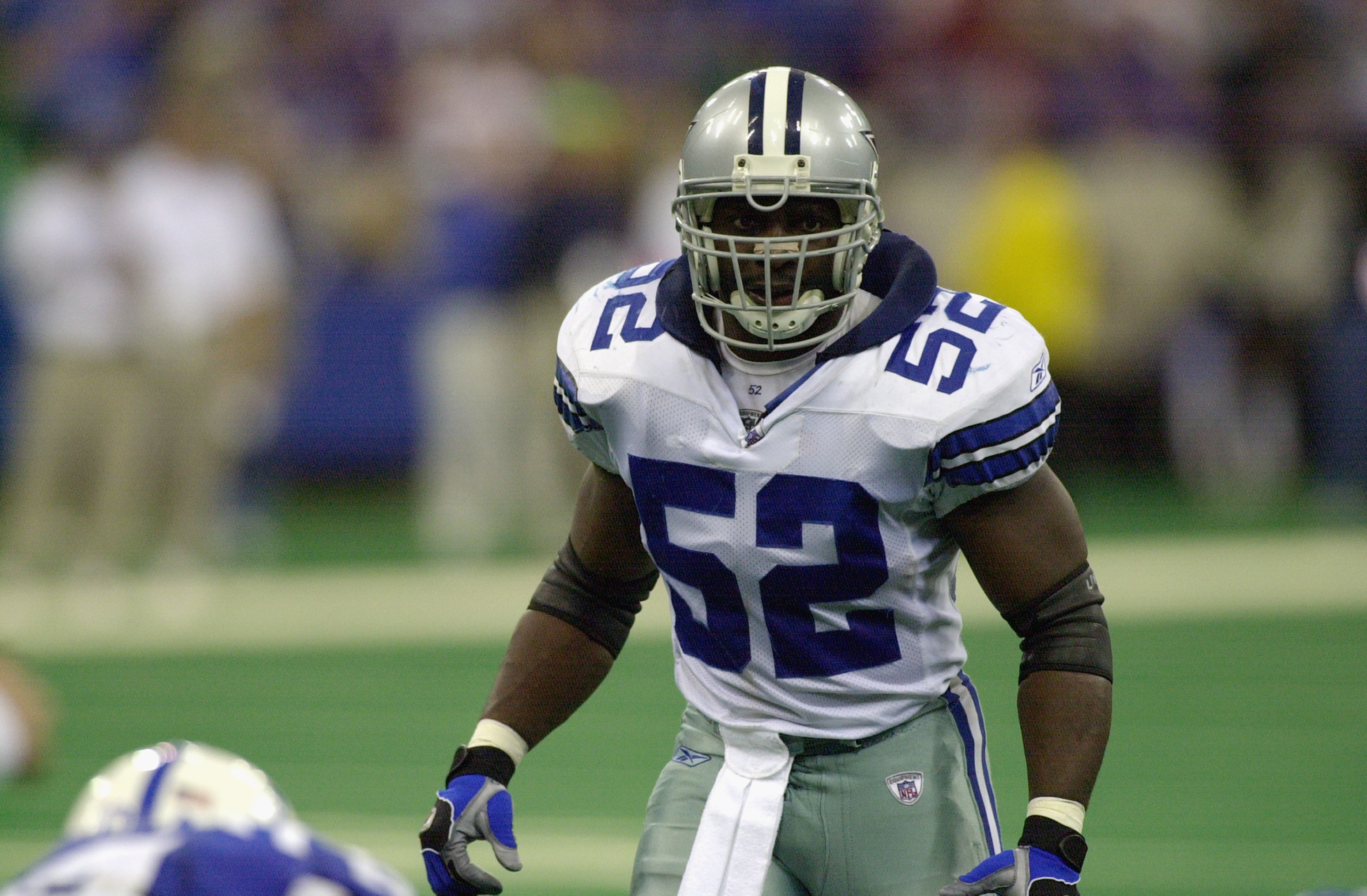 INDIANAPOLIS-NOVEMBER 17:  Dexter Coakley #52 of the Dallas Cowboys looks over the line of scrimmage during their game against the Indianapolis Colts on November 17, 2002 at the RCA Dome in Indianapolis, Indiana. The Colts defeated the Cowboys 20-3.  (Pho