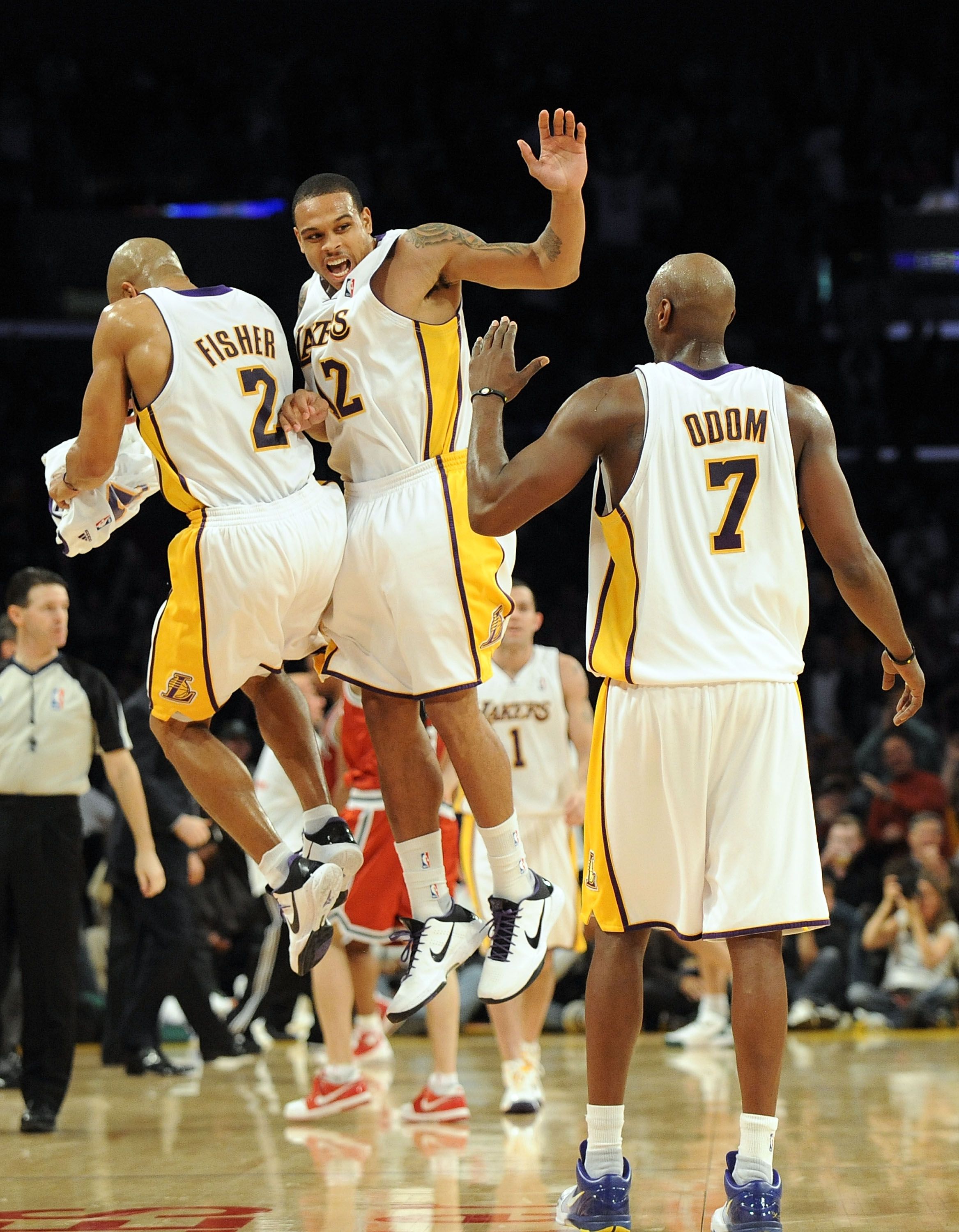 LOS ANGELES, CA - JANUARY 10:  Shannon Brown #12 of the Los Angeles Lakers celebrates his last second three pointer to end the third quarter with Derek Fisher #2 and Lamar Odum #7 against the Milwaukee Bucks at Staples Center on January 10, 2010 in Los An