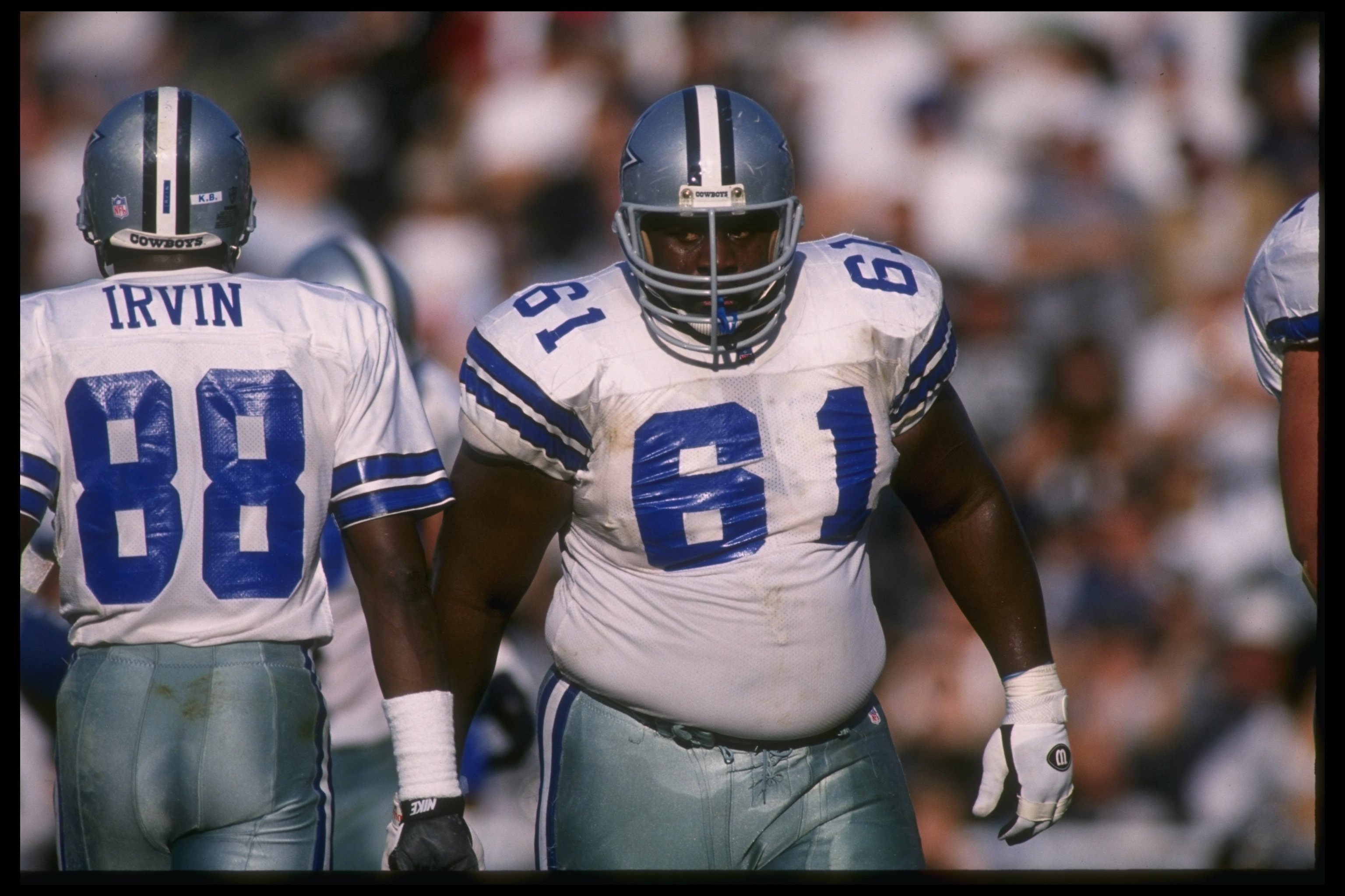 19 Nov 1995: Dallas Cowboys wide receiver Michael Irvin and offensive lineman Nate Newton look on during a game against the Oakland Raiders at Oakland Stadium in Oakland, California. The Cowboys won the game, 34-21.