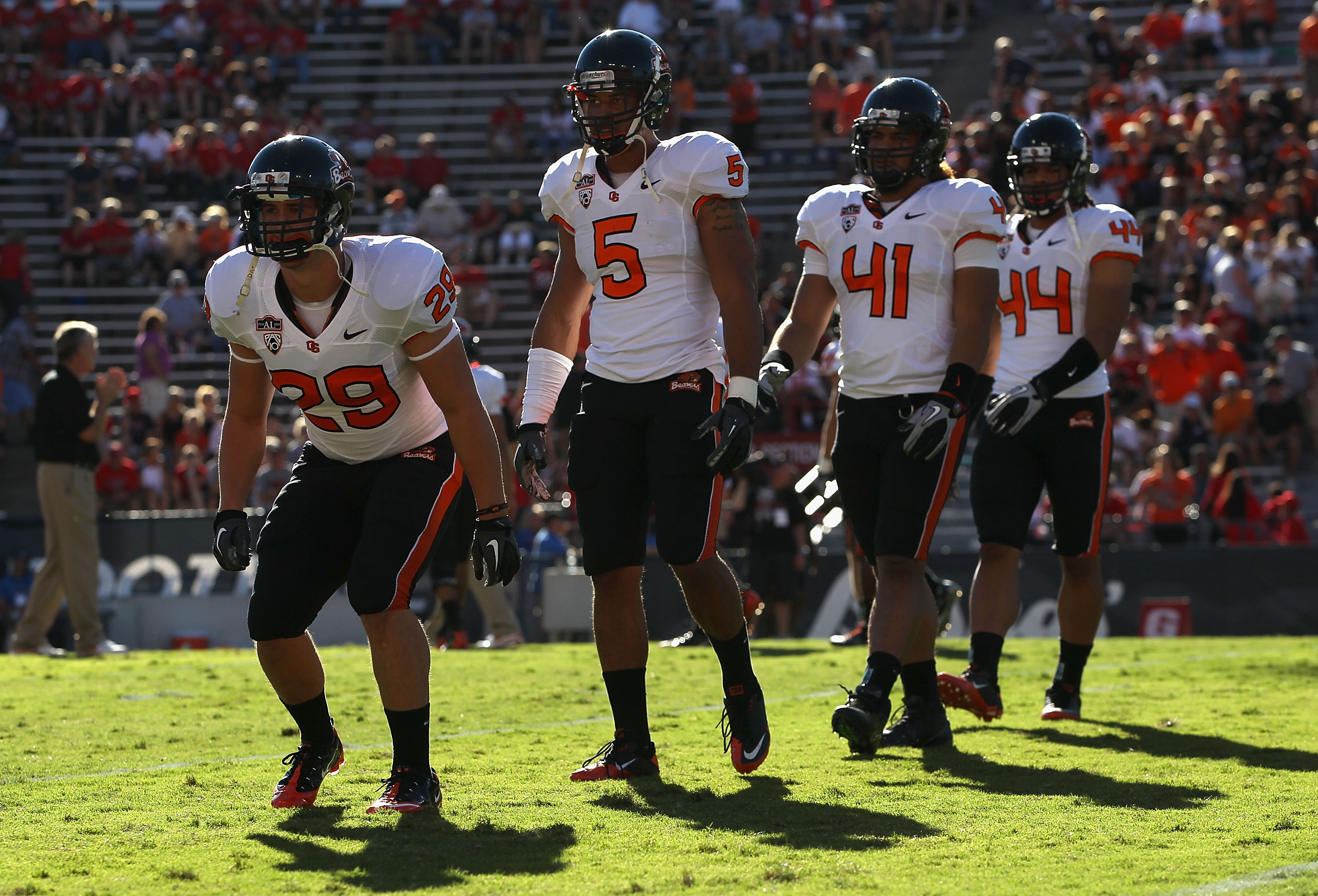 TUCSON, AZ - OCTOBER 09: (L-R) Zane Norris #29, Cameron Collins #5, Feti Unga #41 and Uani Unga #44 of the Oregon State Beavers warm up before the college football game against the Arizona Wildcats at Arizona Stadium on October 9, 2010 in Tucson, Arizon