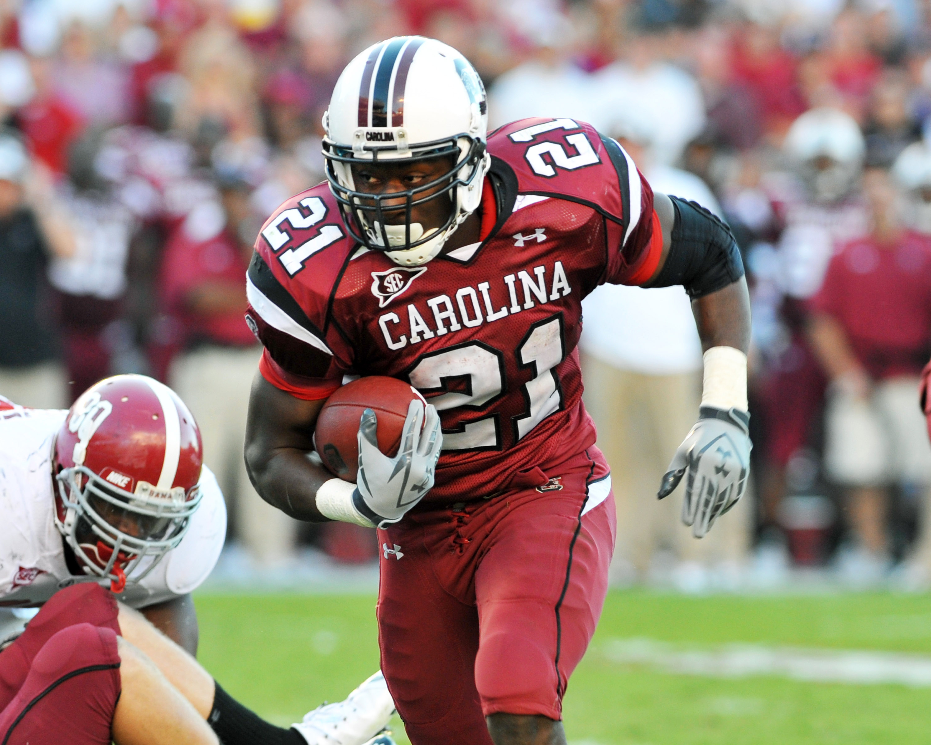 COLUMBIA, SC - OCTOBER 9: Running back Marcus Lattimore #21 of the South Carolina Gamecocks rushes upfield against the Alabama Crimson Tide October 9, 2010 at Williams-Brice Stadium in Columbia, South Carolina.  (Photo by Al Messerschmidt/Getty Images)