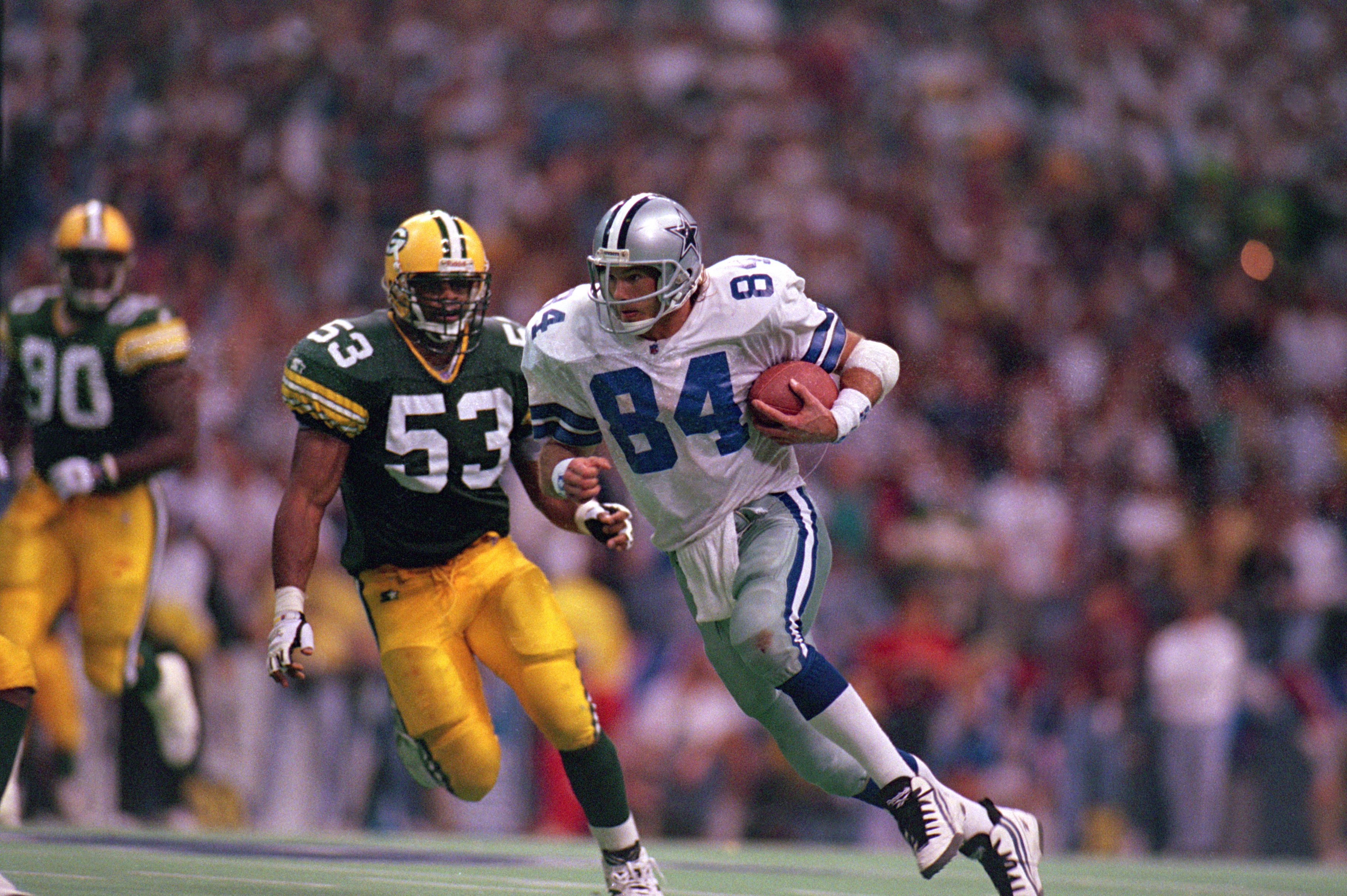 IRVING, TX - JANUARY 14: Jay Novacek #84 of the Dallas Cowboys carries the ball during a game against the Green Bay Packers at Texas Stadium on January 14, 1996 in Irving, Texas. The Cowboys won 38-27 . (Photo by: Al Bello/Getty Images)