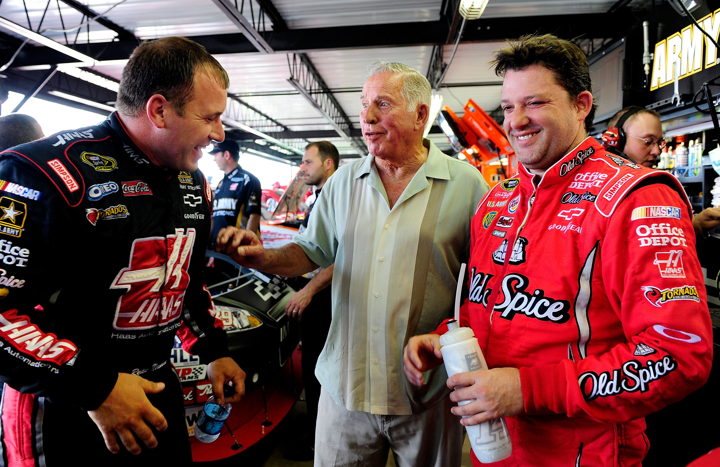 DARLINGTON, SC - MAY 07:  Ryan Newman (L), driver of the #39 Haas Automation Chevrolet, talks with NASCAR legend David Pearson (C), and Tony Stewart (R), driver of the #14 Old Spice/Office Depot Chevrolet, in the garage during practice for the NASCAR Spri