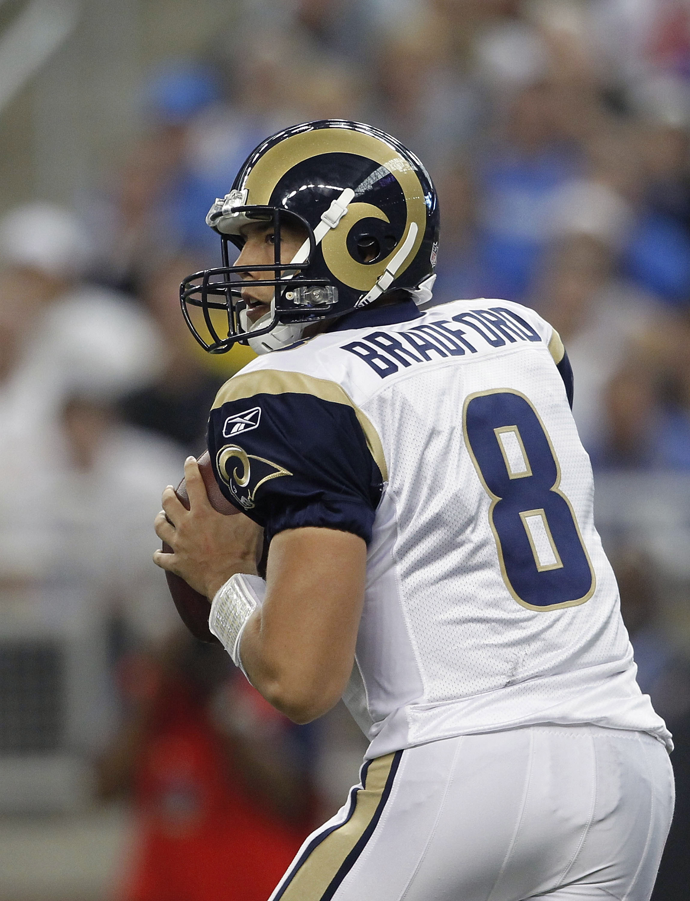 DETROIT - OCTOBER 10:  Sam Bradford #8 of the St. Louis Rams drops back to pass during the fourth quarter during the game against the Detroit Lions at Ford Field on October 10, 2010 in Detroit, Michigan. The Lions defeated the Rams 44-6.  (Photo by Leon H