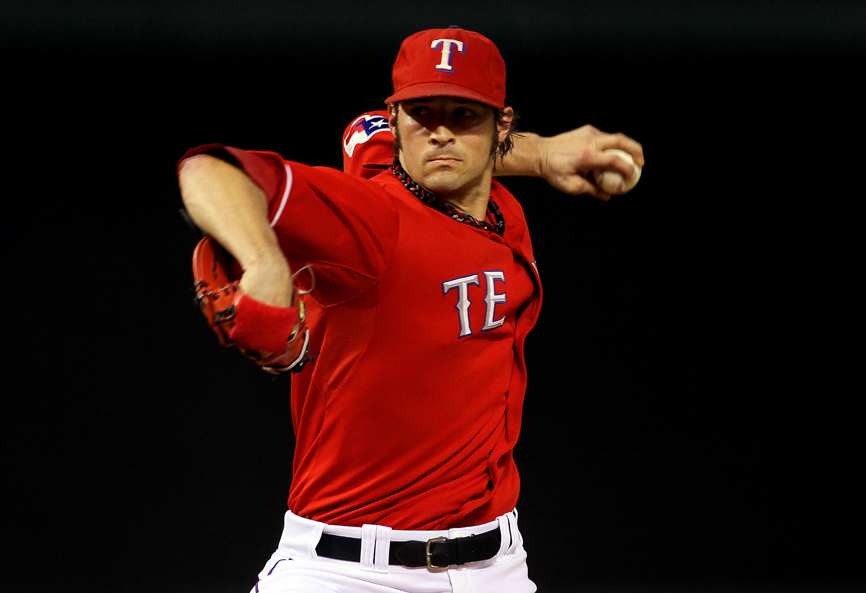 ARLINGTON, TX - OCTOBER 15: C.J. Wilson #36 of the Texas Rangers pitches against the New York Yankees in Game One of the ALCS during the 2010 MLB Playoffs at Rangers Ballpark in Arlington on October 15, 2010 in Arlington, Texas.  (Photo by Stephen Dunn/Ge