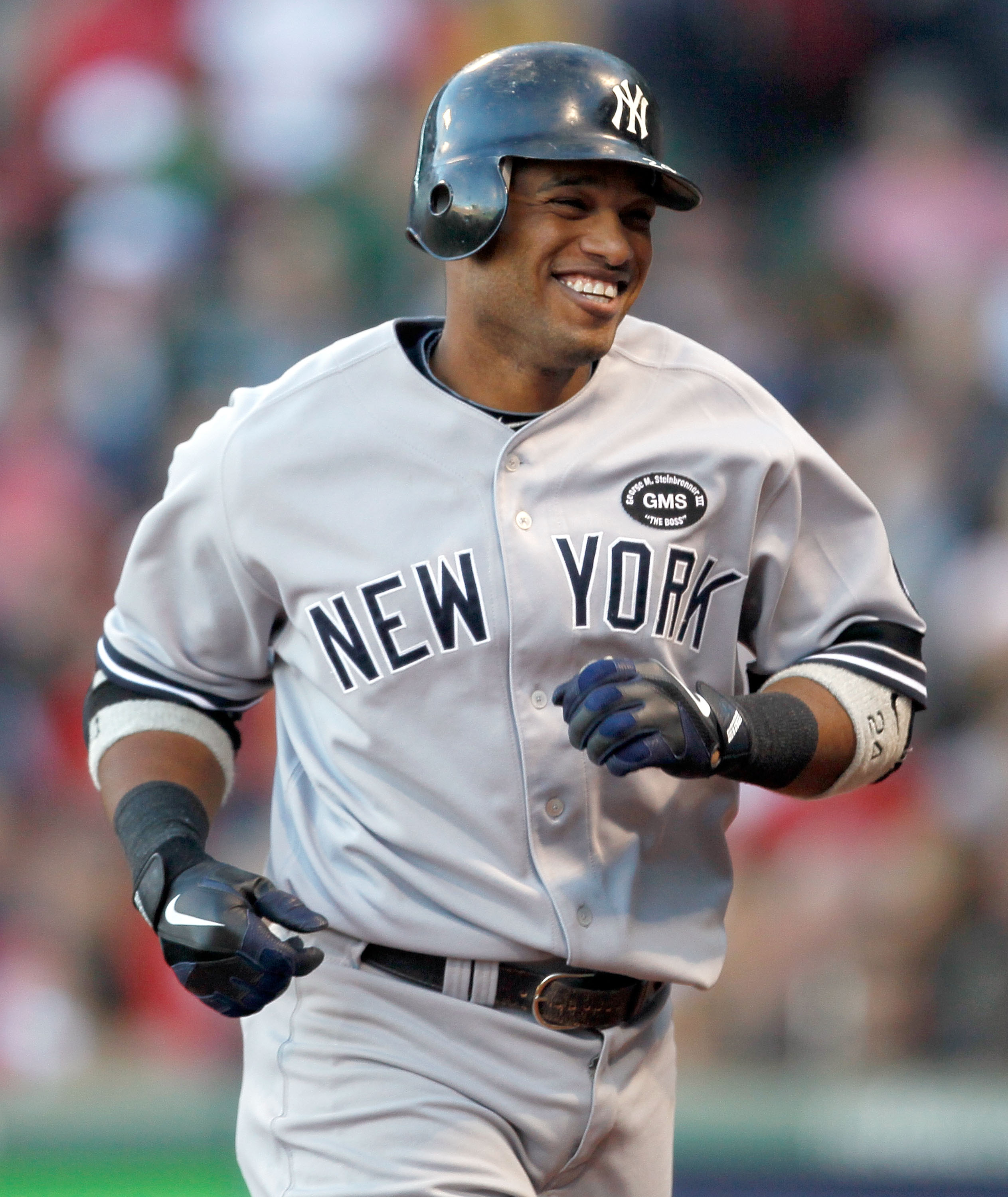 BOSTON - OCTOBER 2:  Robinson Cano #24 of the New York Yankees smiles after hitting a solo home run in the third inning during the first game of a doubleheader against the Boston Red Sox at Fenway Park October 2, 2010 in Boston, Massachusetts. (Photo by J