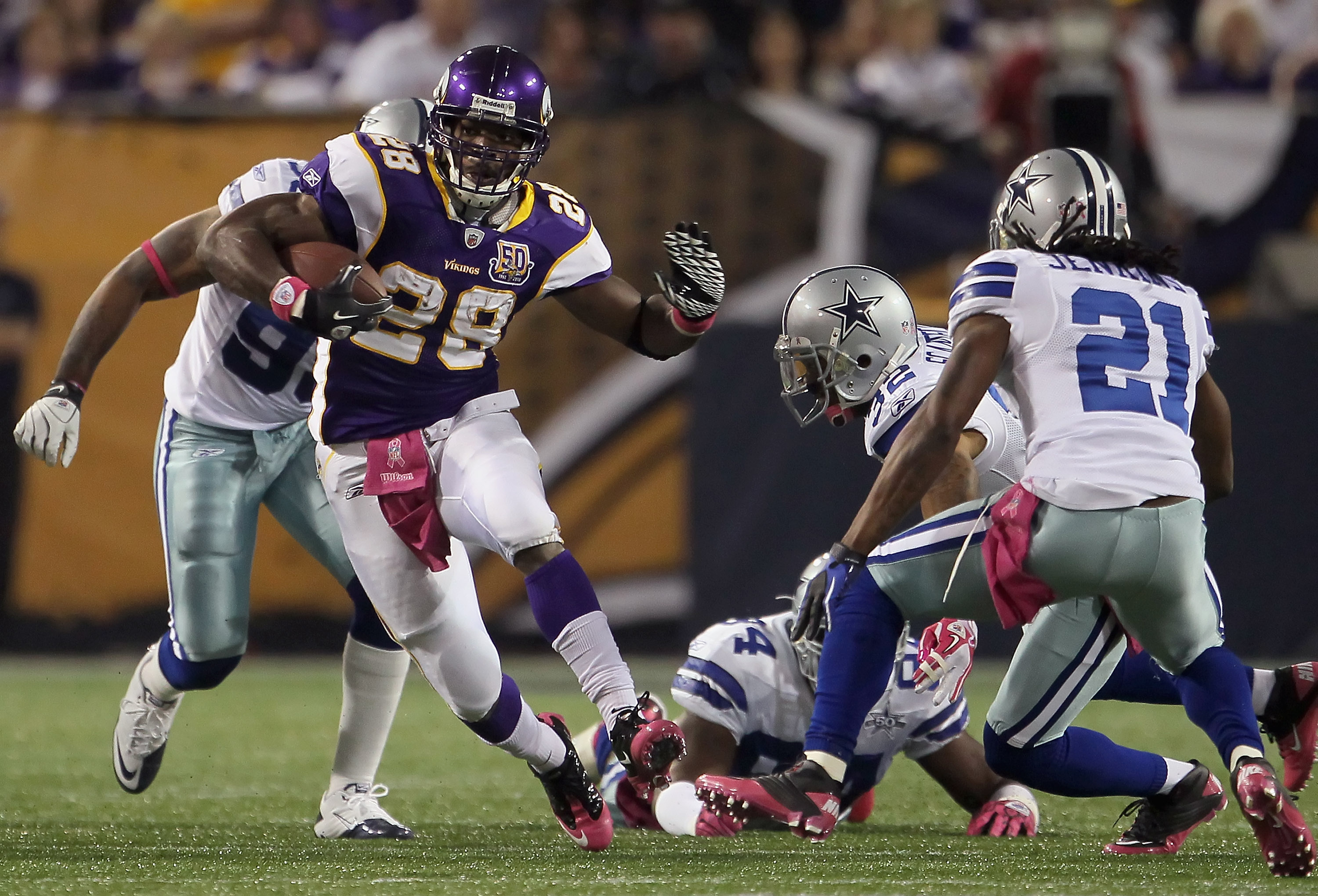 Dallas Cowboys Roy Williams (11) gave his gloves to fans during the second  quarter of an NFL game against the Minnesota Vikings. The Vikings defeated  the Cowboys, 24-21, at Mall of America