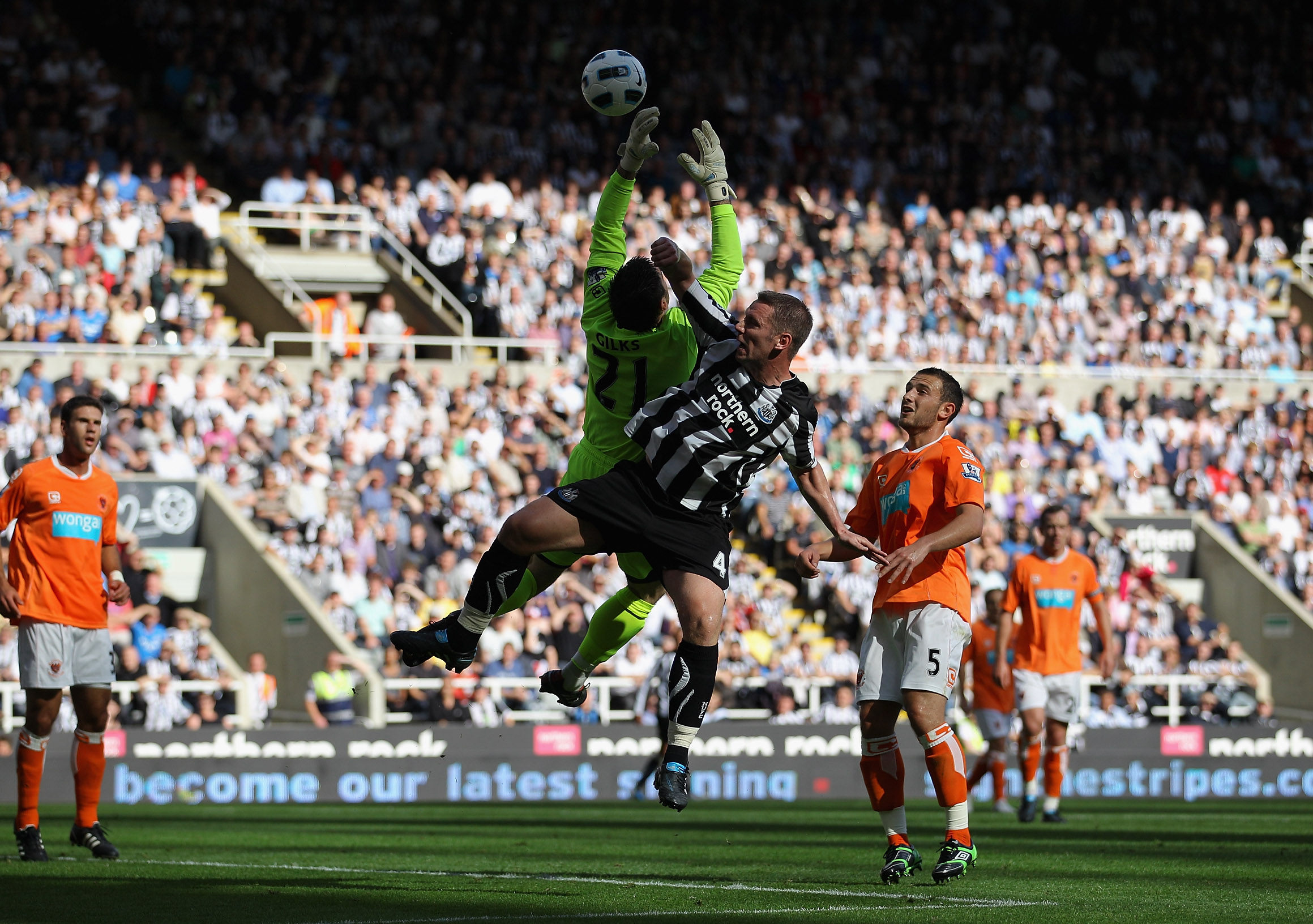 NEWCASTLE UPON TYNE, ENGLAND - SEPTEMBER 11:  Blackpool goalkeeper Matthew Gilks saves from Kevin Nolan during the Barclays Premier League match between Newcastle United and Blackpool at St James' Park on September 11, 2010 in Newcastle upon Tyne, England