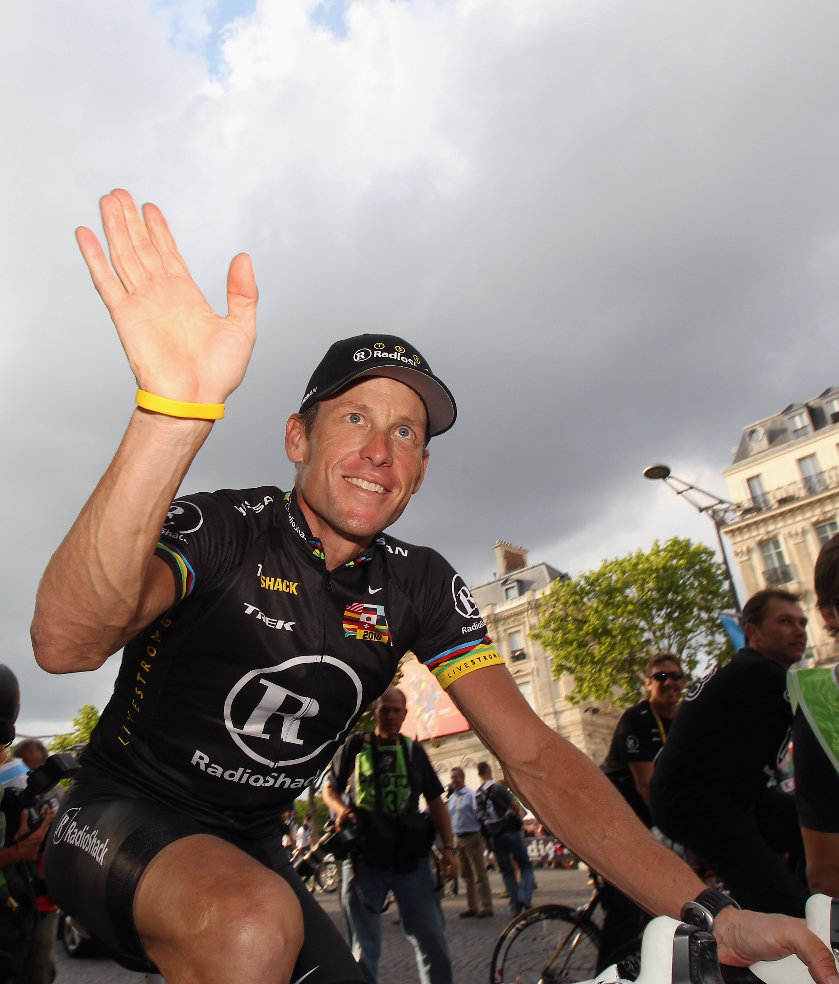 PARIS - JULY 25:  Lance Armstrong of team Radioshack waves to fans after the twentieth and final stage of Le Tour de France 2010, from Longjumeau to the Champs-Elysees in Paris on July 25, 2010 in Paris, France.  (Photo by Bryn Lennon/Getty Images)